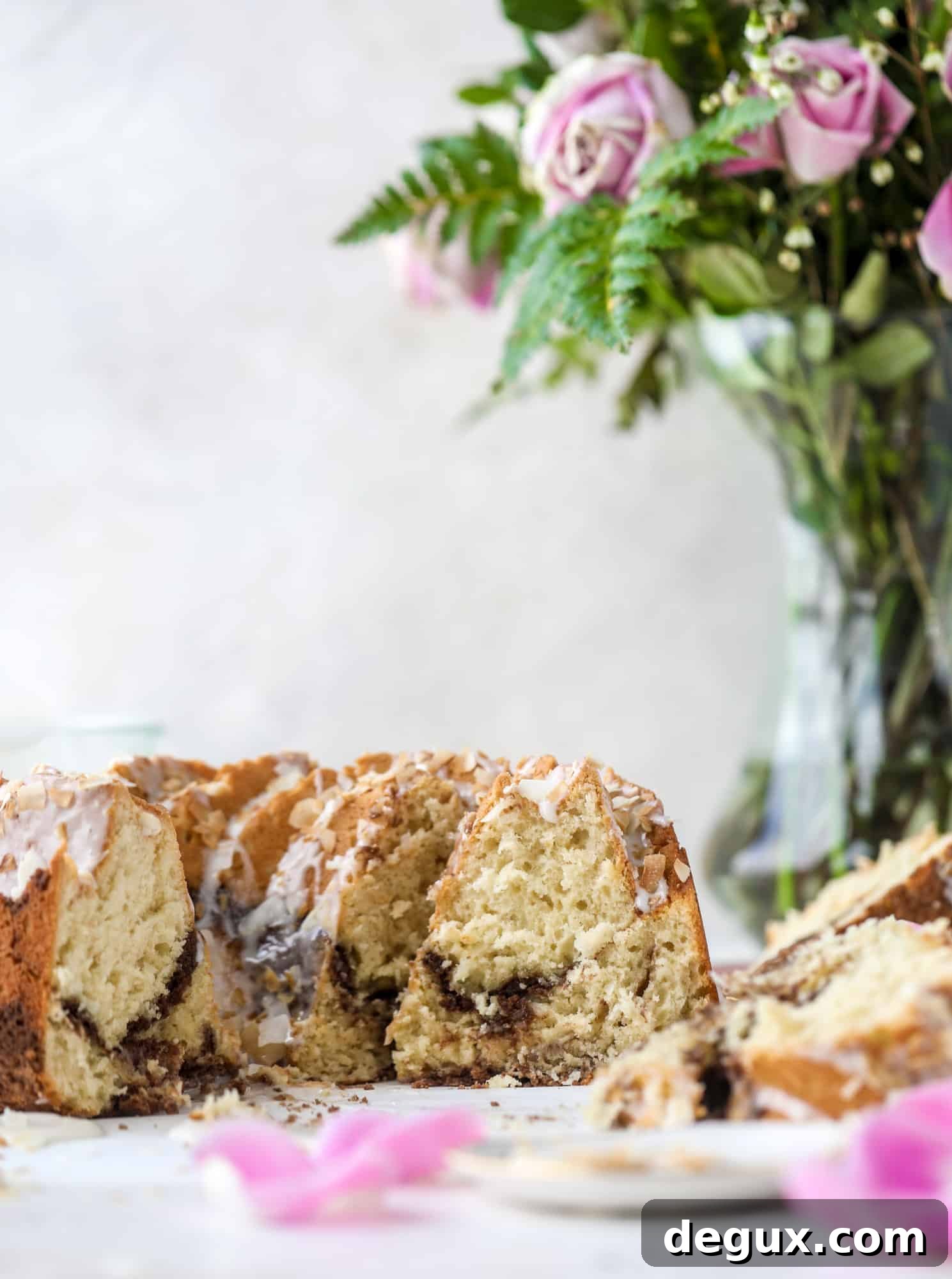 Make breakfast and brunch better with coconut coffee cake! Tender coconut cake with a cocoa sugar streusel and a coconut glaze. To die for!
