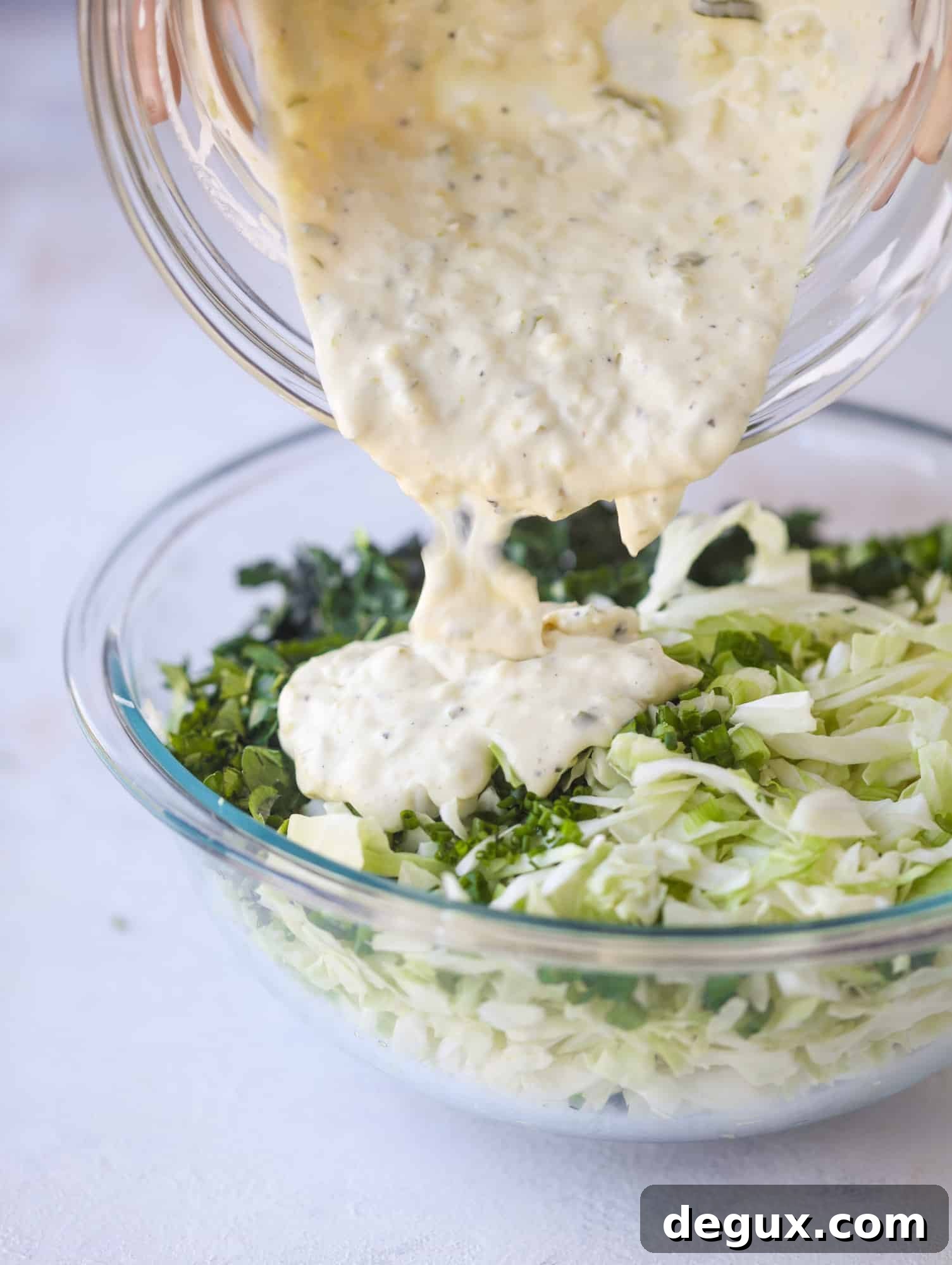 Crispy Fish Sandwich with Kale Coleslaw Recipe 4 A light and crispy fish sandwich made with a simple beer batter and topped with a hearty, creamy kale cole slaw. Loaded with flavor! I howsweeteats.com #crispyfish #sandwich