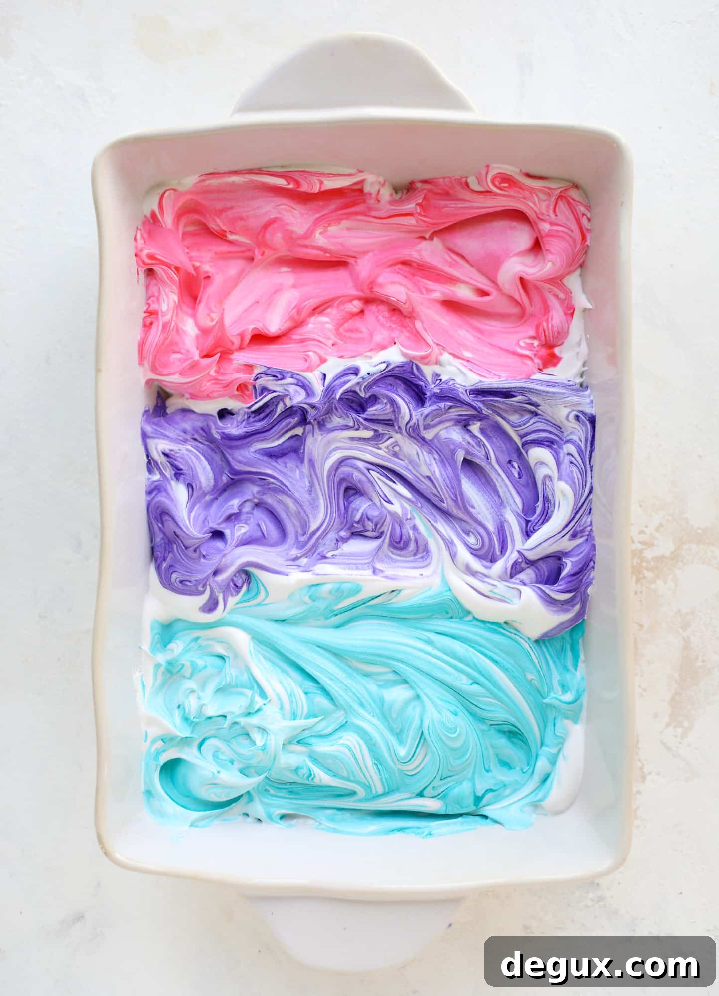 This is how to dye eggs with cool whip! It's so fun, super kid-friendly and ridiculously easy too. I love using this method to make unicorn eggs!