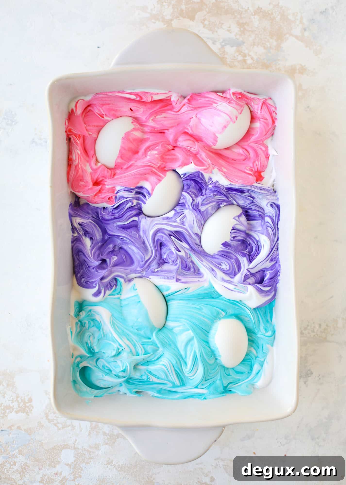 This is how to dye eggs with cool whip! It's so fun, super kid-friendly and ridiculously easy too. I love using this method to make unicorn eggs!