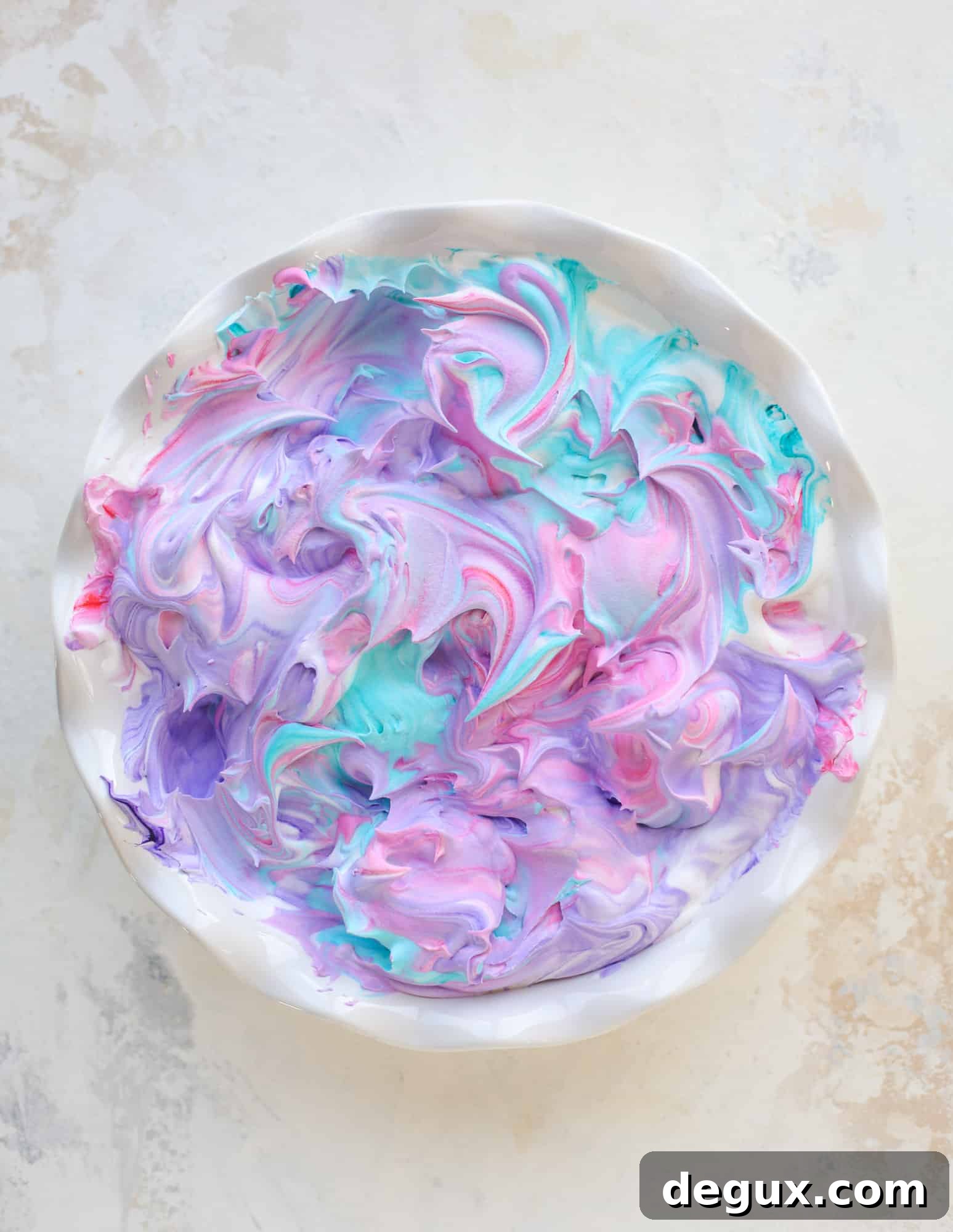 This is how to dye eggs with cool whip! It's so fun, super kid-friendly and ridiculously easy too. I love using this method to make unicorn eggs!