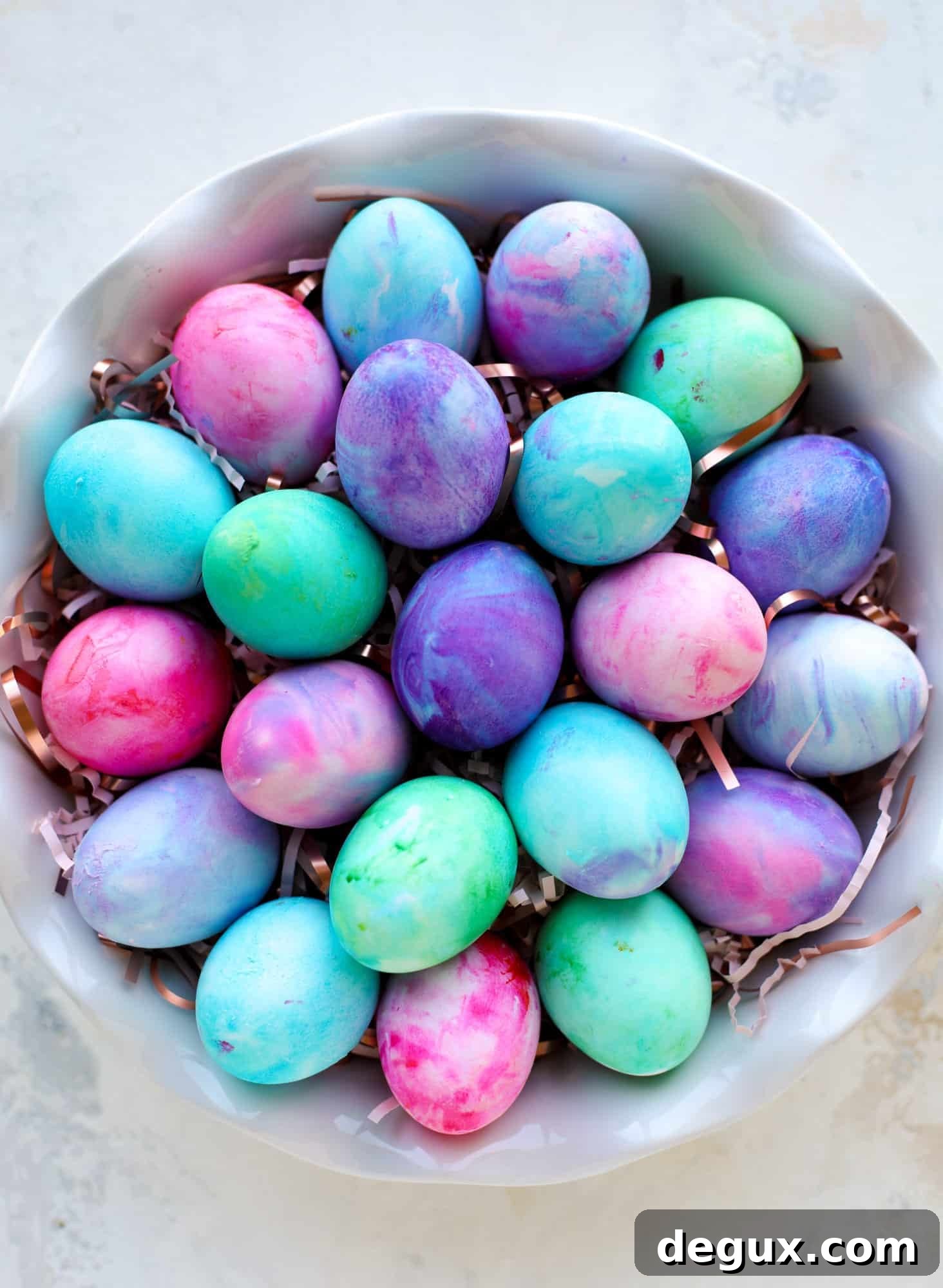 This is how to dye eggs with cool whip! It's so fun, super kid-friendly and ridiculously easy too. I love using this method to make unicorn eggs!