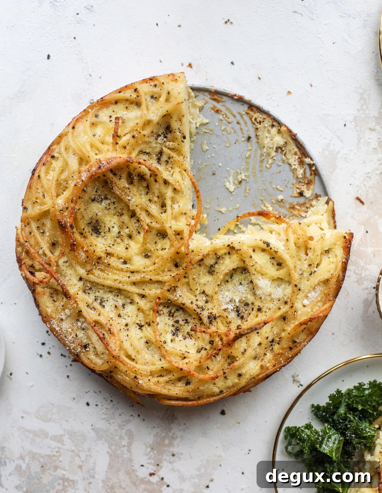 Hello lover! Cacio e pepe pie is made with parmigiano-reggiano cheese, black pepper and bucatini pasta. Baked until cheese and bubbly, it's to die for.