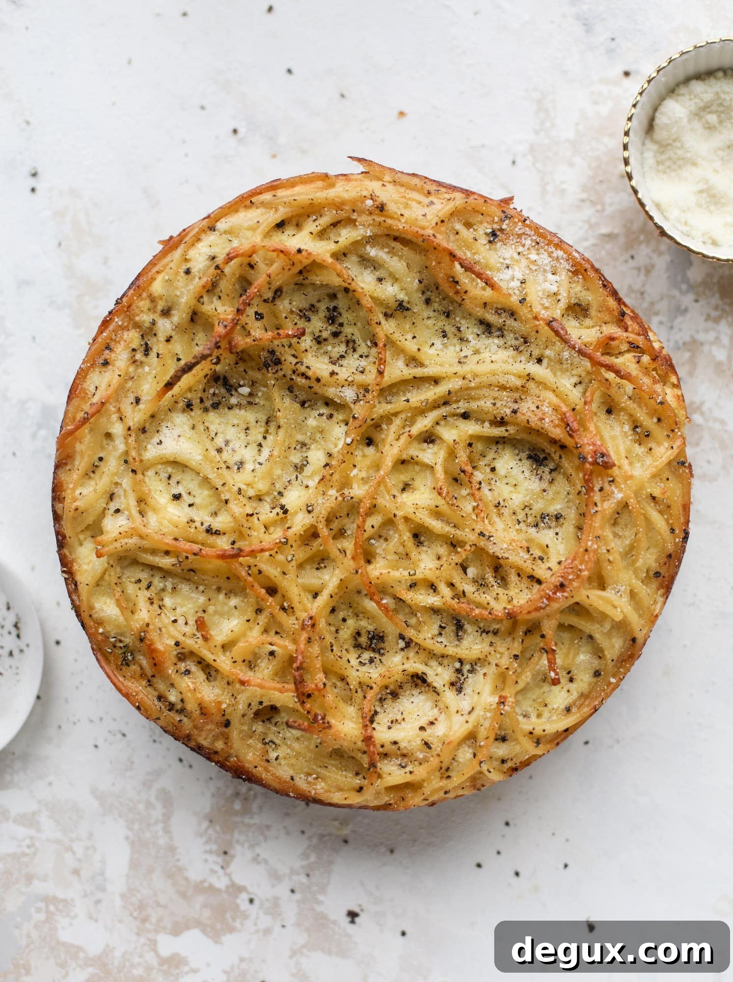 Hello lover! Cacio e pepe pie is made with parmigiano-reggiano cheese, black pepper and bucatini pasta. Baked until cheese and bubbly, it's to die for.