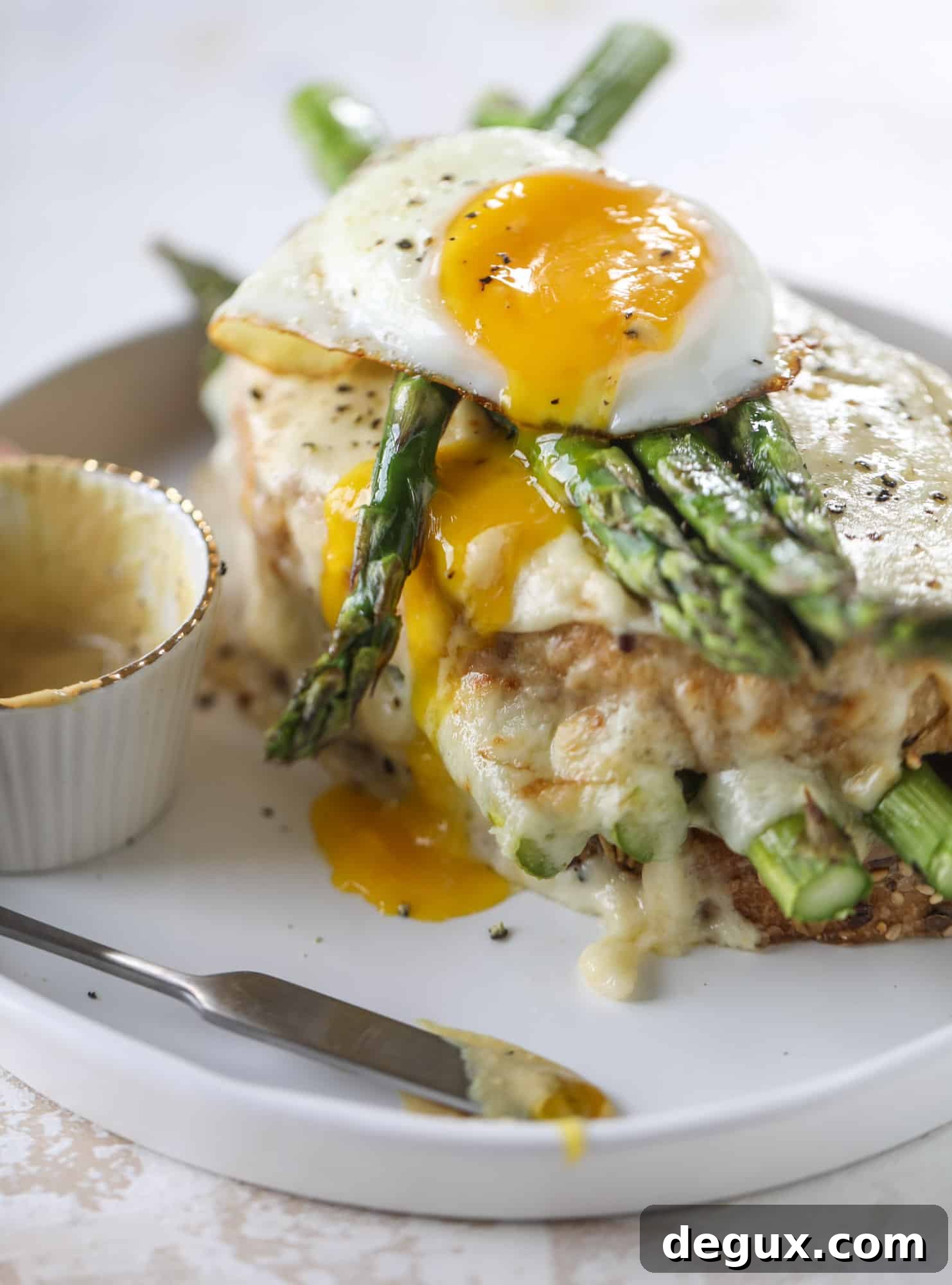 Roasted Asparagus and Prosciutto Croque-Madame Recipe 2 This roasted asparagus croque madame is made with thinly-sliced prosciutto and a fontina cheese sauce. Lots of dijon and an egg on top!