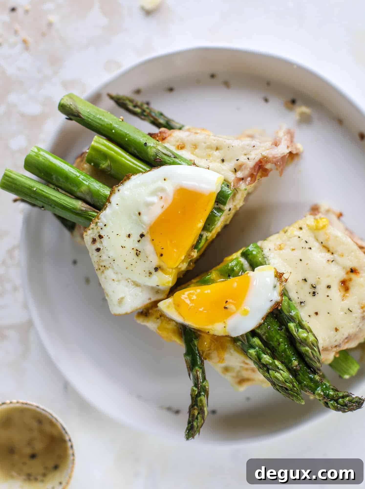 Roasted Asparagus and Prosciutto Croque-Madame Recipe 10 This roasted asparagus croque madame is made with thinly-sliced prosciutto and a fontina cheese sauce. Lots of dijon and an egg on top!