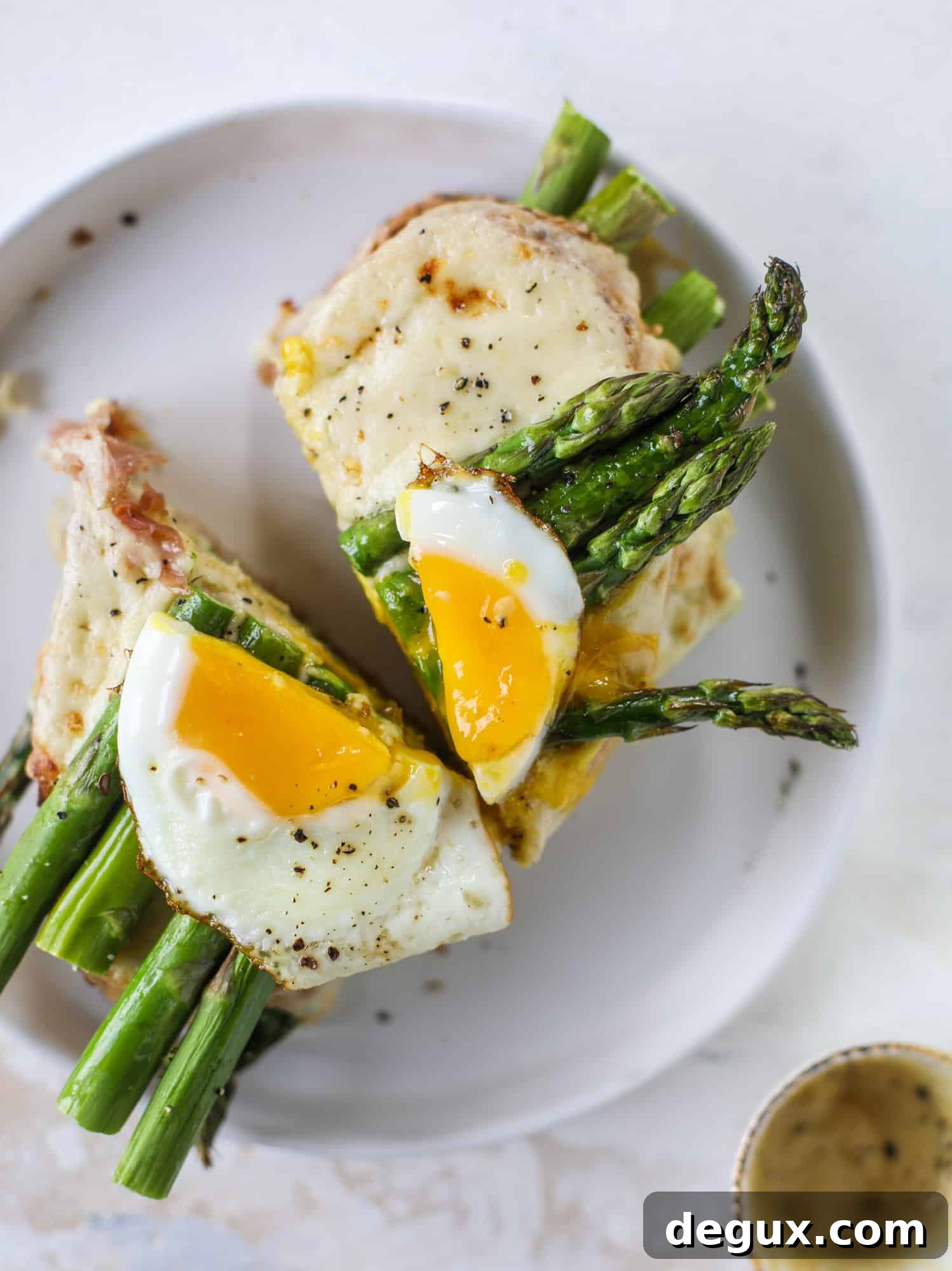 Roasted Asparagus and Prosciutto Croque-Madame Recipe 3 This roasted asparagus croque madame is made with thinly-sliced prosciutto and a fontina cheese sauce. Lots of dijon and an egg on top!