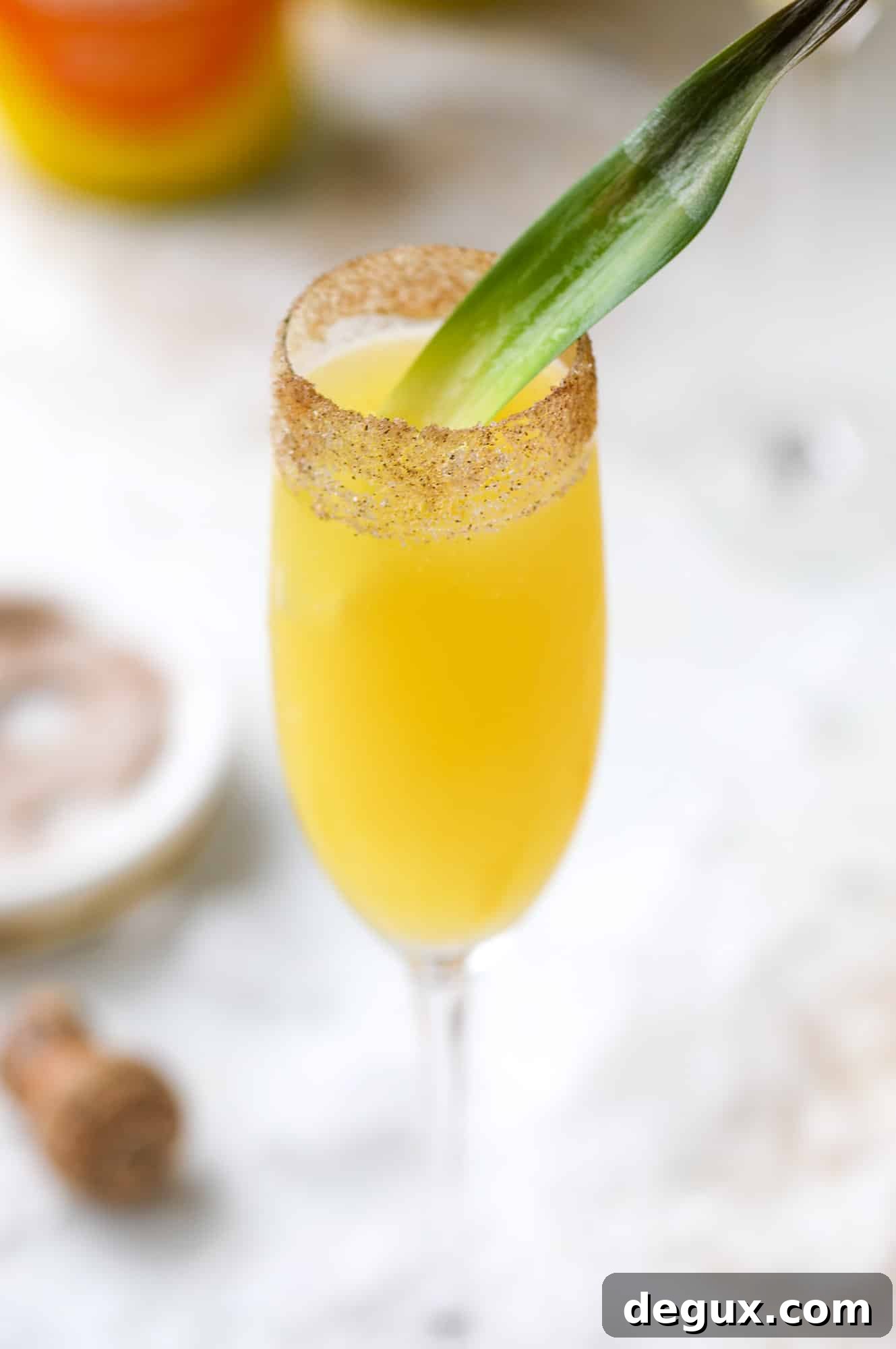Hummingbird Mimosa Cocktail Recipe for Spring Brunch 7 The hummingbird mimosa is a spin on the classic hummingbird cake: pineapple juice, orange juice, champagne and a cinnamon sugar rim!