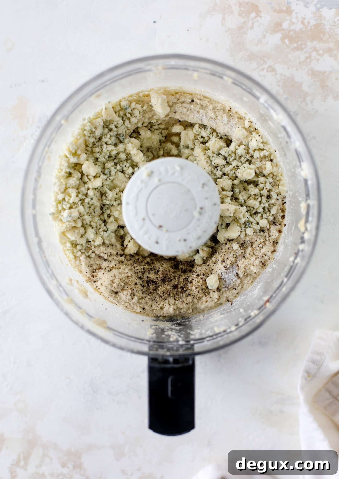 Creamy Cashew Blue Cheese Dip Recipe for Parties and Snacks 3 cashews and blue cheese in the food processor for dip