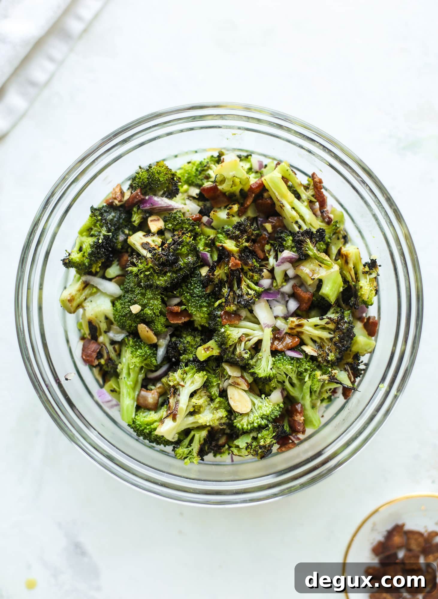 My favorite broccoli salad is here! This broccoli crunch salad is full of grilled broccoli, sliced almonds, diced scallions and crunchy bacon. It's so good!