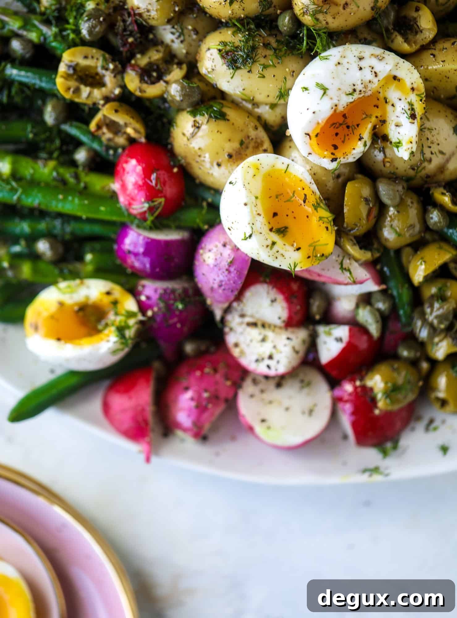Spring Niçoise Salad Recipe for Fresh Seasonal Ingredients 4 This spring version of the nicoise salad is loaded with crunchy green beans and asparagus, gorgeous radishes, tender potatoes and salty olives.