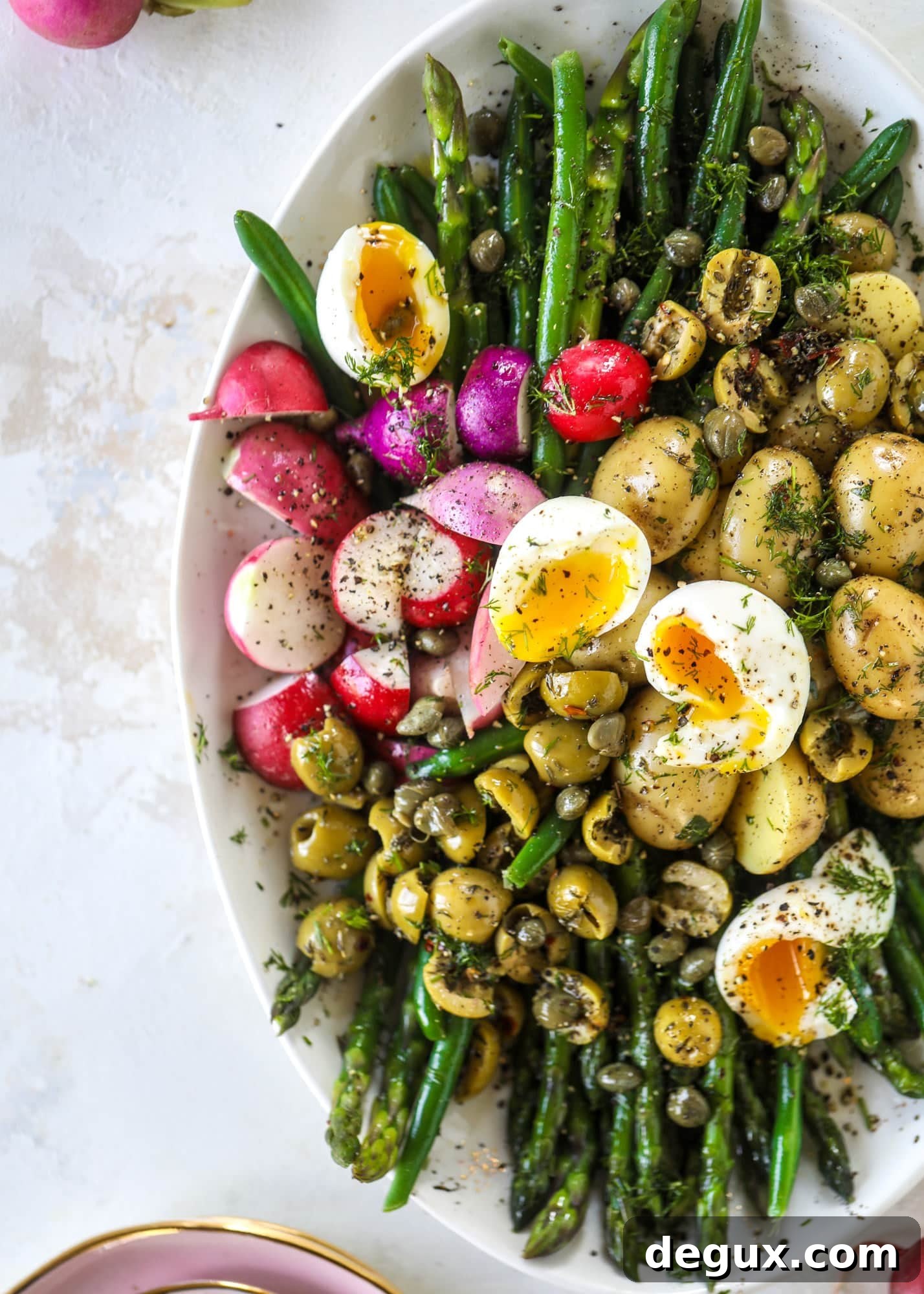 Spring Niçoise Salad Recipe for Fresh Seasonal Ingredients 7 This spring version of the nicoise salad is loaded with crunchy green beans and asparagus, gorgeous radishes, tender potatoes and salty olives.