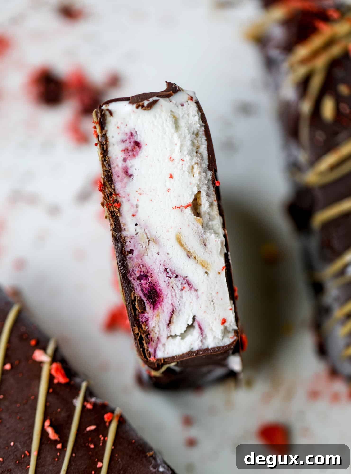 These frozen peanut butter jelly bars are super easy and made with an oatmilk frozen dessert, then covered in a dark chocolate shell. Delish!