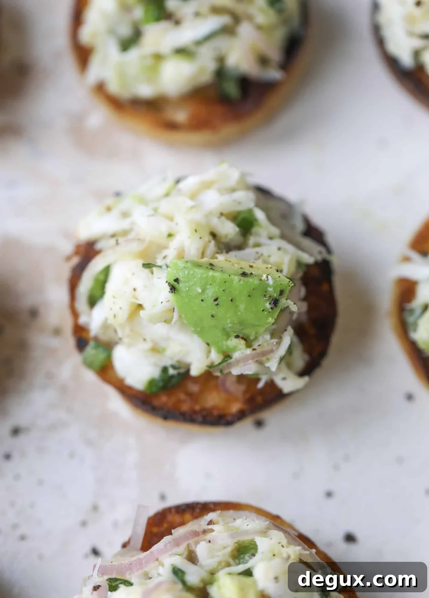 Crab and Avocado Salad on Garlic Butter Toast 4 The cutest crab salad toasts are perfect for a snack, appetizer or light meal with a greens salad. This avocado crab salad is so refreshing and light!
