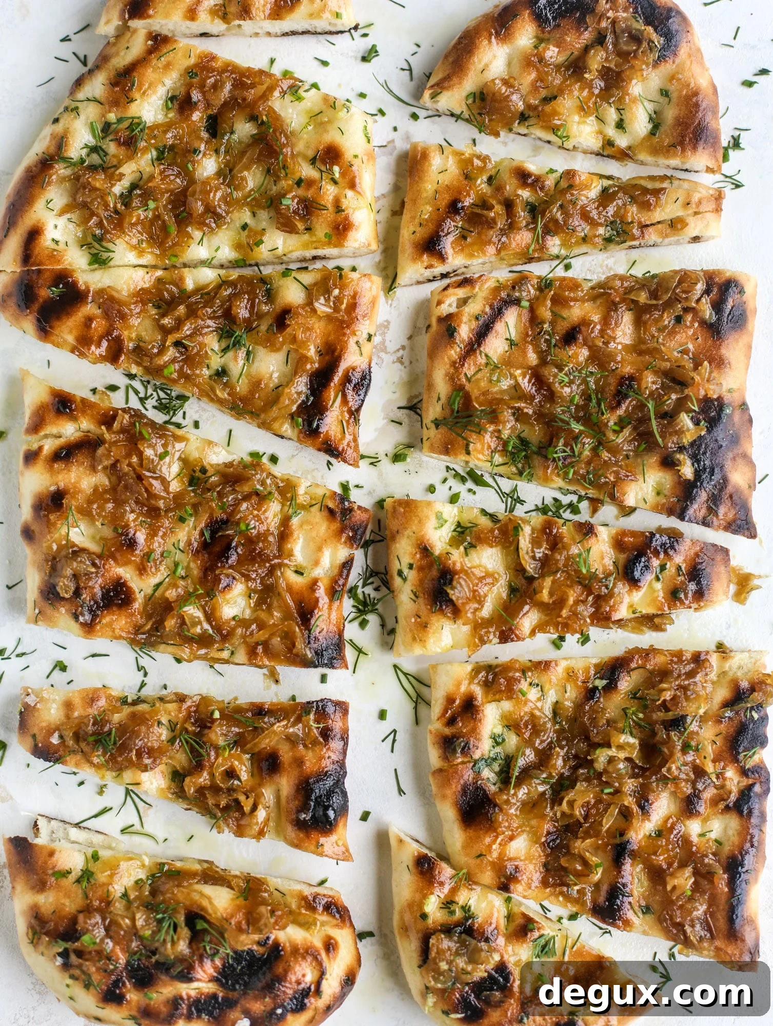 Caramelized Onion & Garlic Butter Grilled Focaccia Recipe 10 Grilled focaccia bread is such a treat! Topped with puddles of garlic butter, fresh chopped herbs and golden, caramelized onions, it's a slice of heaven.