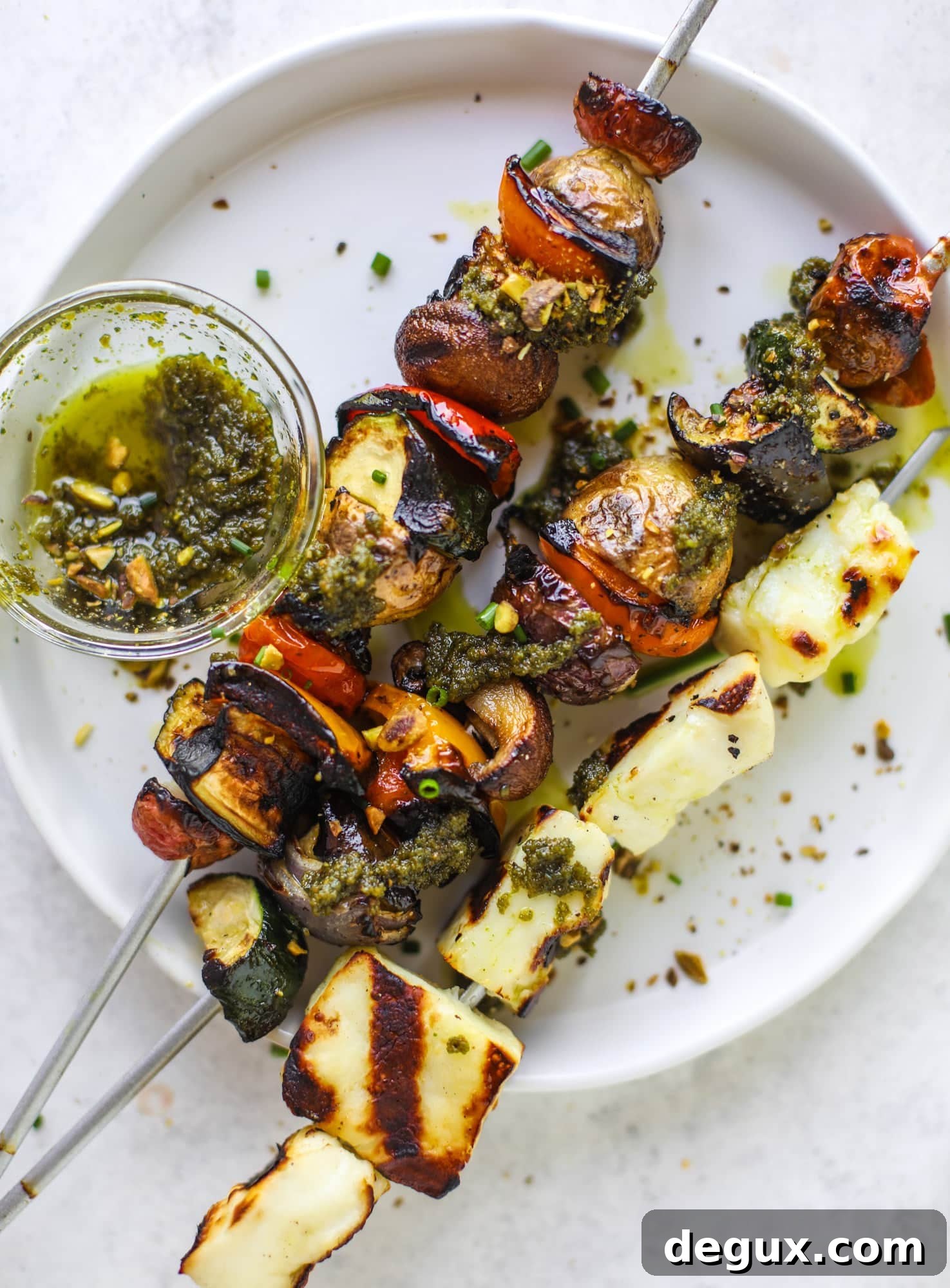 My all time favorite grilled vegetable skewers served with grilled halloumi cheese and pistachio pesto! Makes the best summer meal ever.