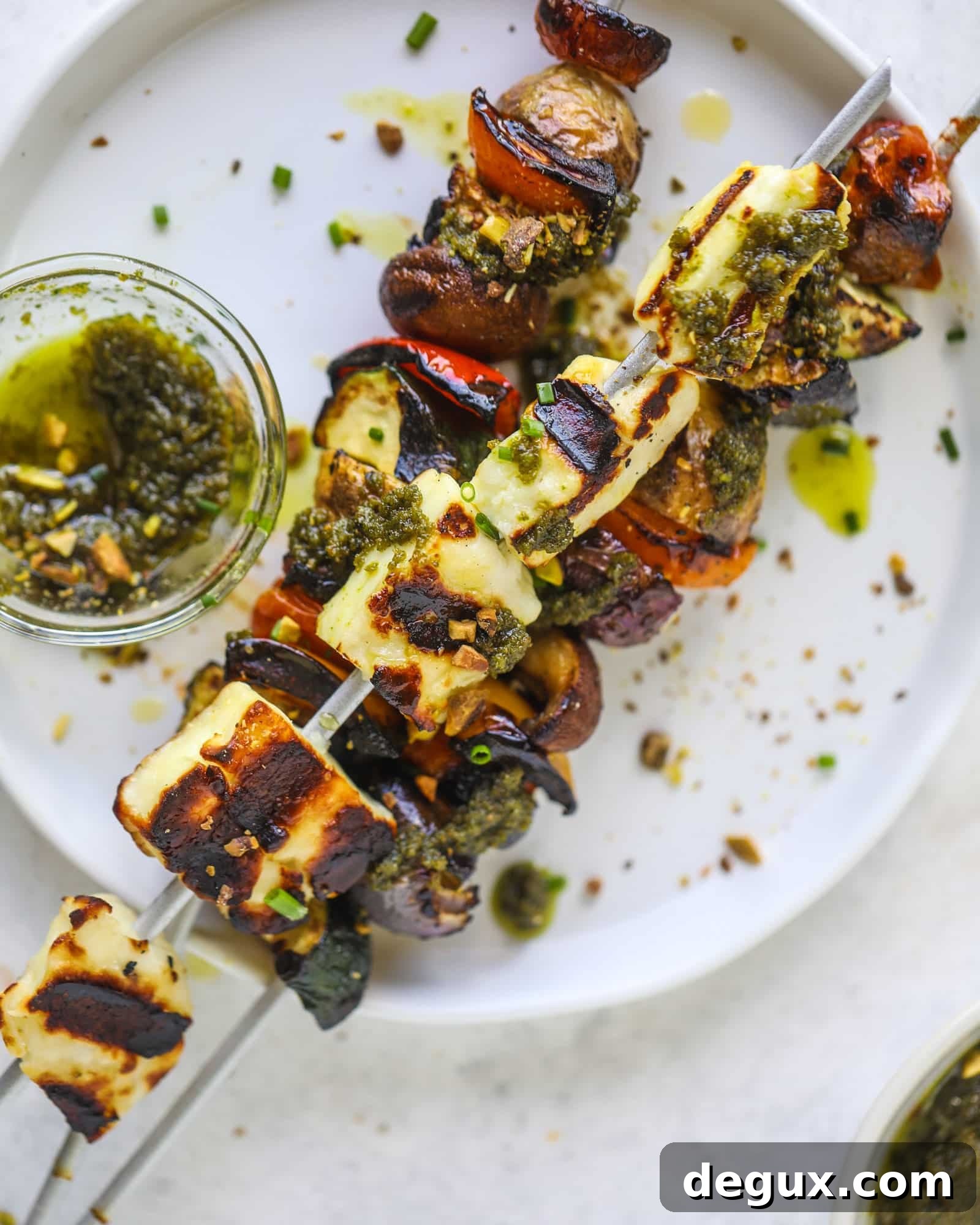 My all time favorite grilled vegetable skewers served with grilled halloumi cheese and pistachio pesto! Makes the best summer meal ever.