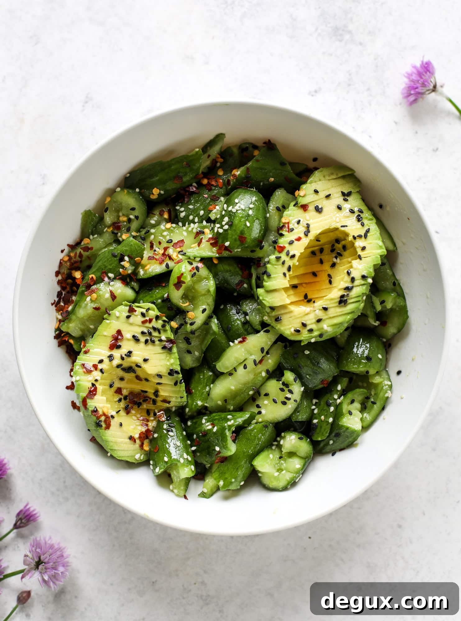 This smashed cucumber salad is so refreshing and perfect for summer! Served with avocado, toasted sesame oil and chives, it's ridiculously flavorful.