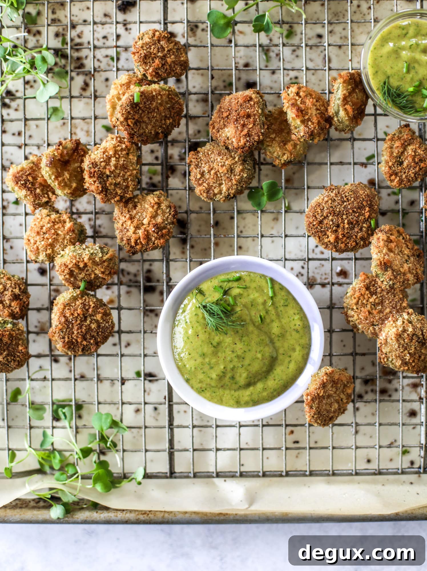 Crispy Oven-Fried Pickles with Green Goddess Ranch Dip 8 Oven fried crispy pickles are super crunchy and delicious! Served with a dairy free green goddess ranch dip, they are the best snack ever.