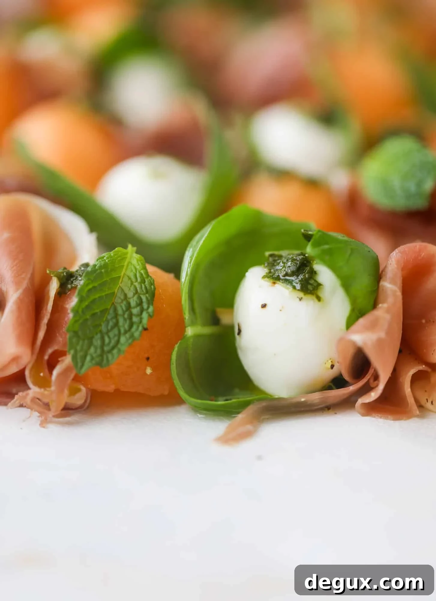 Cantaloupe Prosciutto Caprese Skewers with Lemon-Mint Pesto 6 These cantaloupe prosciutto skewers are the perfect cantaloupe caprese snack! Salty prosciutto, sweet melon and fresh mozzarella drizzled with mint pesto!