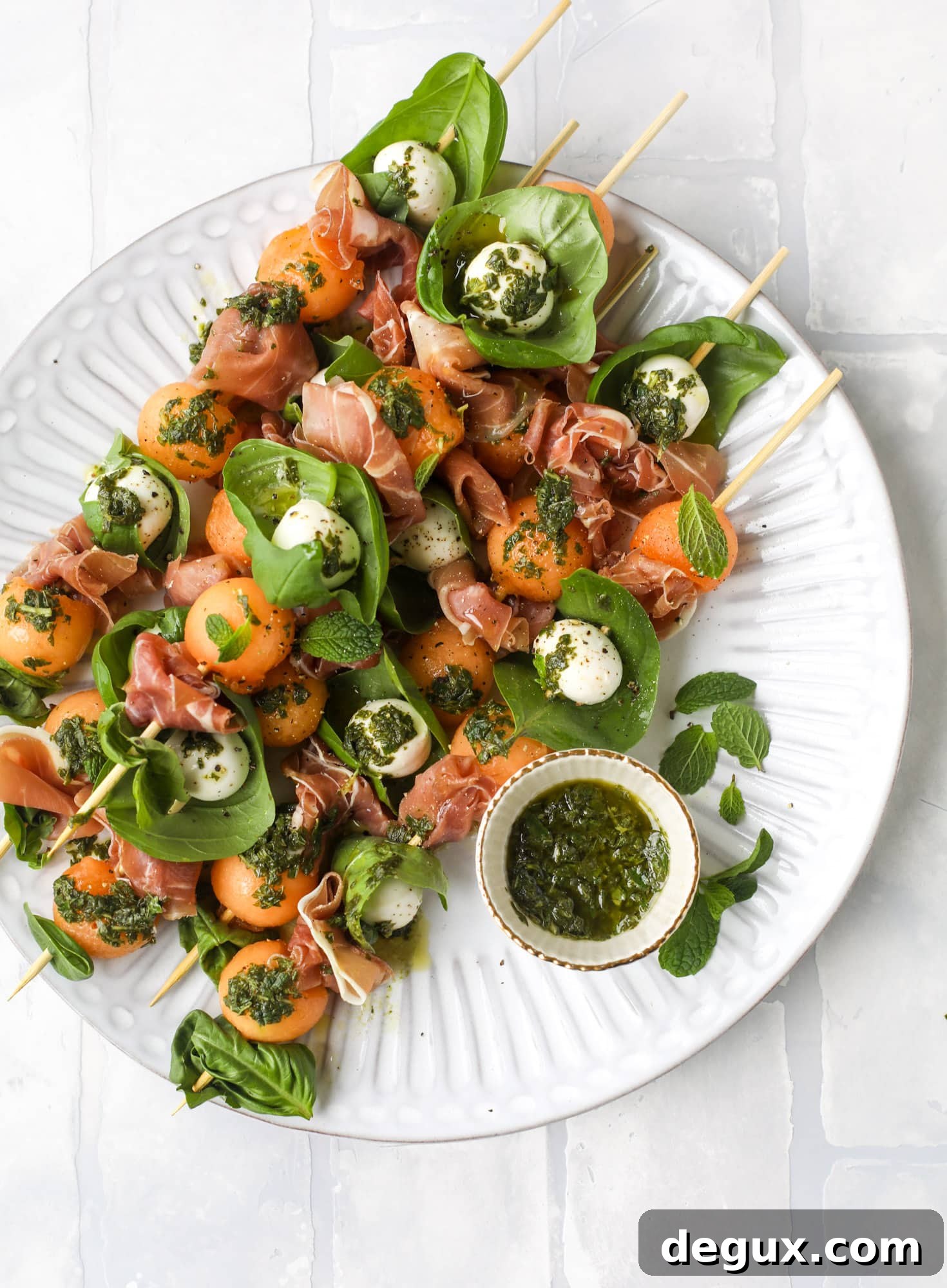 Cantaloupe Prosciutto Caprese Skewers with Lemon-Mint Pesto 8 These cantaloupe prosciutto skewers are the perfect cantaloupe caprese snack! Salty prosciutto, sweet melon and fresh mozzarella drizzled with mint pesto!