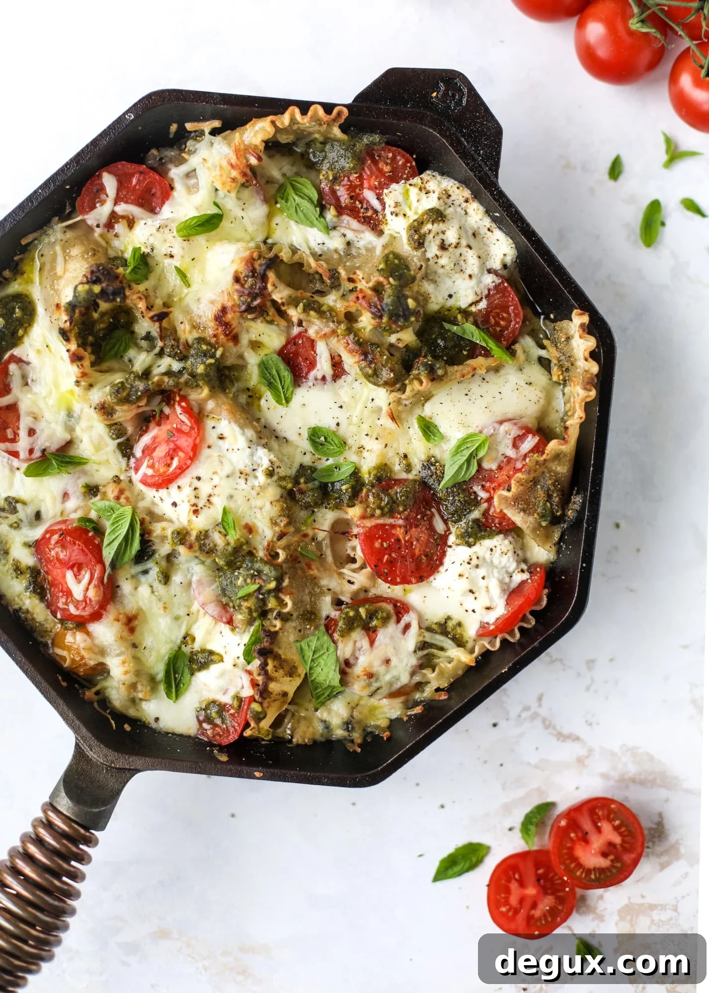 Quick caprese skillet lasagna is a lovely and comforting summer meal! Lots of fresh basil, ripe tomatoes and cheese bring this easy weeknight meal together.