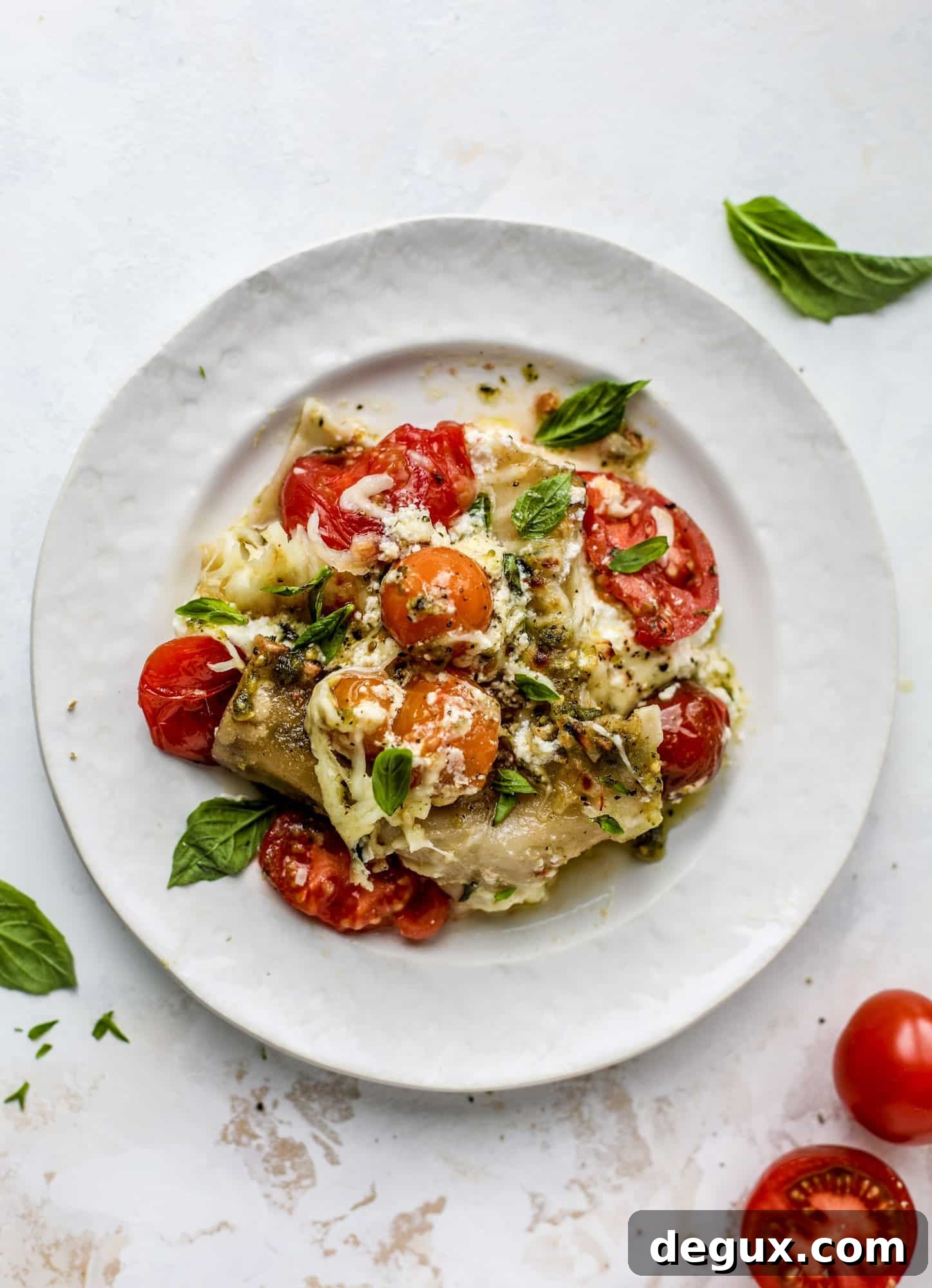 Quick caprese skillet lasagna is a lovely and comforting summer meal! Lots of fresh basil, ripe tomatoes and cheese bring this easy weeknight meal together.