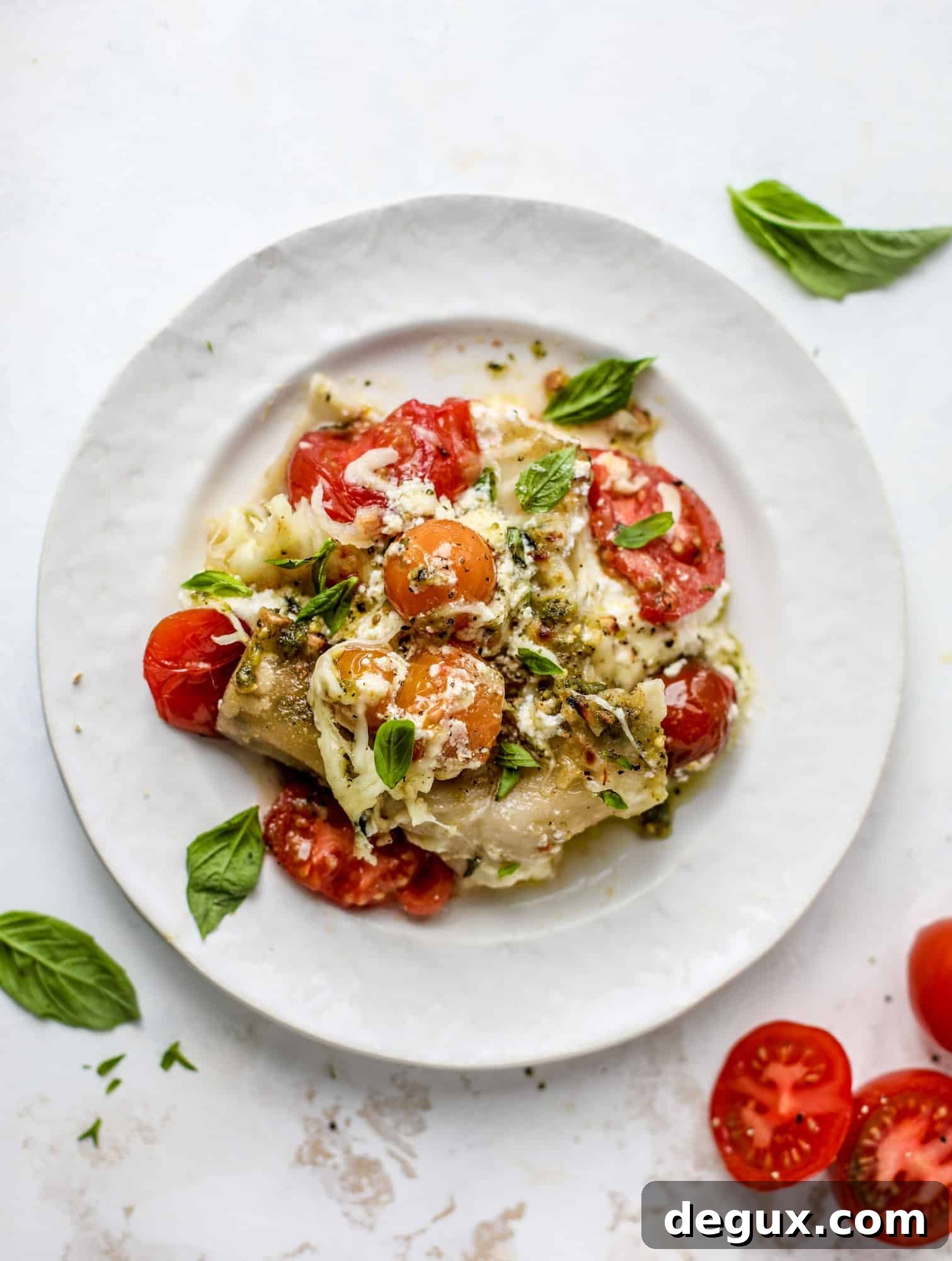 Quick caprese skillet lasagna is a lovely and comforting summer meal! Lots of fresh basil, ripe tomatoes and cheese bring this easy weeknight meal together.