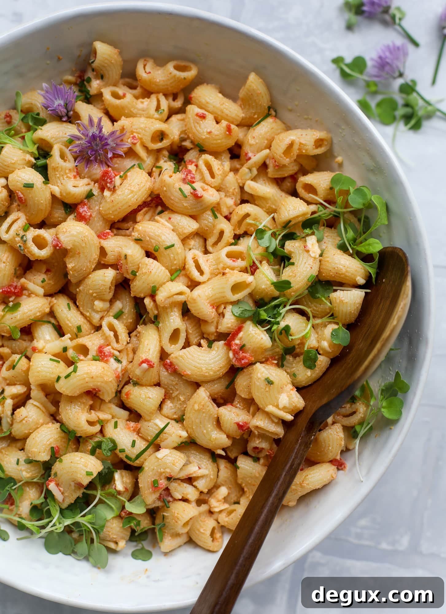 This pimento cheese pasta salad is the perfect summer side dish! All the flavor of pimento cheese and all the comforts of pasta salad, in one bowl!