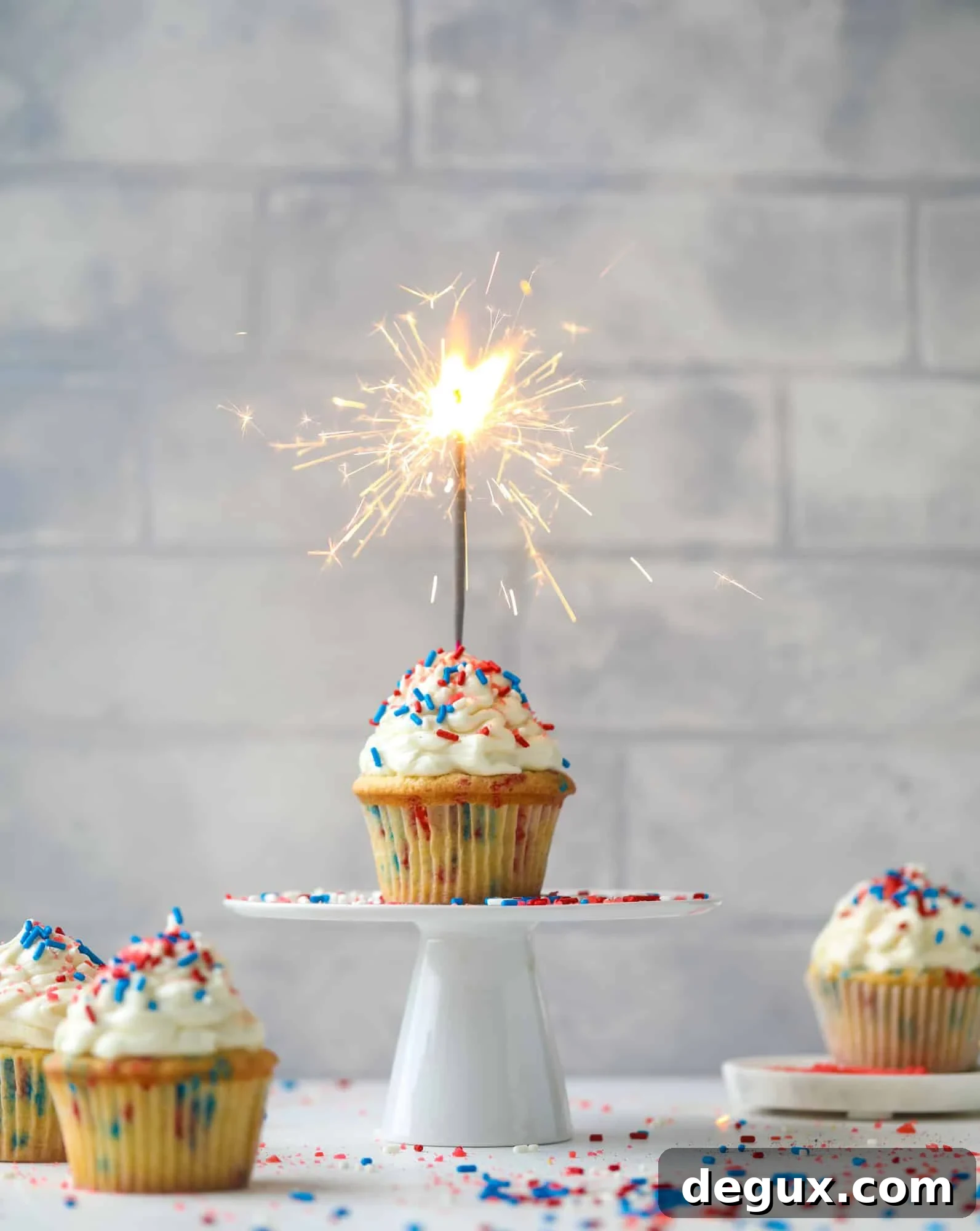 Firecracker Confetti Cupcakes Recipe for Party-Ready Treats 2 These 4th of July confetti cupcakes are super fun! Firecracker cupcakes with red, white and blue sprinkles and pop rocks candy on top for crackle!