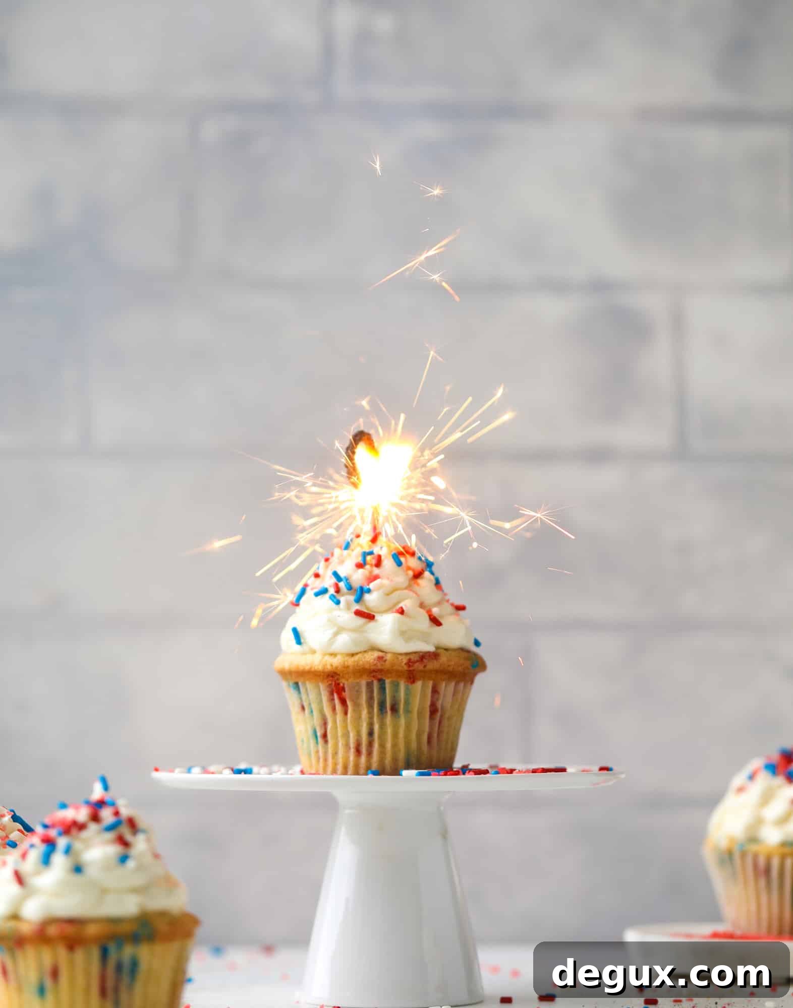 Firecracker Confetti Cupcakes Recipe for Party-Ready Treats 11 These 4th of July confetti cupcakes are super fun! Firecracker cupcakes with red, white and blue sprinkles and pop rocks candy on top for crackle!