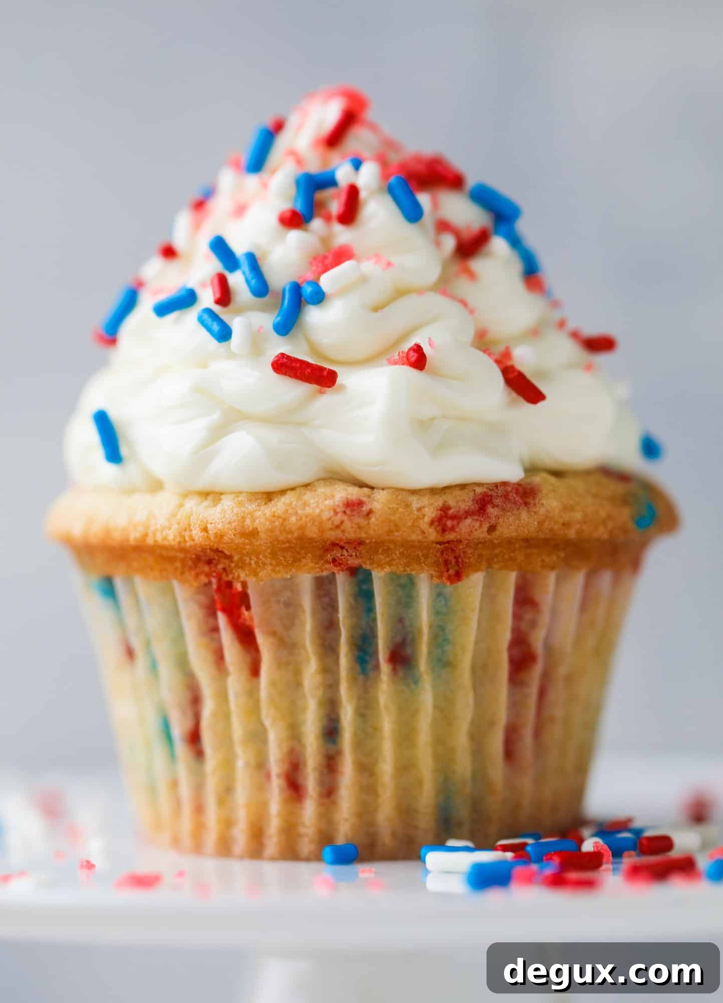 Firecracker Confetti Cupcakes Recipe for Party-Ready Treats 5 These 4th of July confetti cupcakes are super fun! Firecracker cupcakes with red, white and blue sprinkles and pop rocks candy on top for crackle!