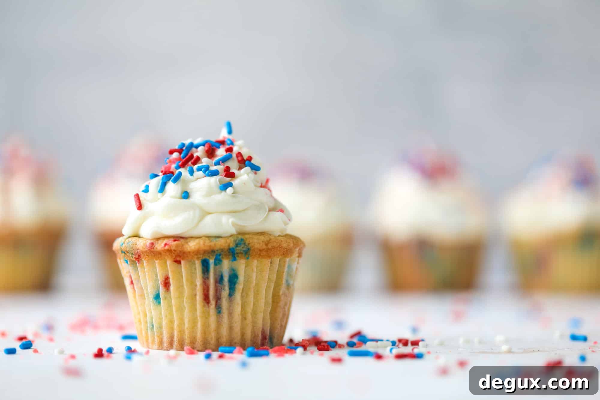 Firecracker Confetti Cupcakes Recipe for Party-Ready Treats 7 These 4th of July confetti cupcakes are super fun! Firecracker cupcakes with red, white and blue sprinkles and pop rocks candy on top for crackle!