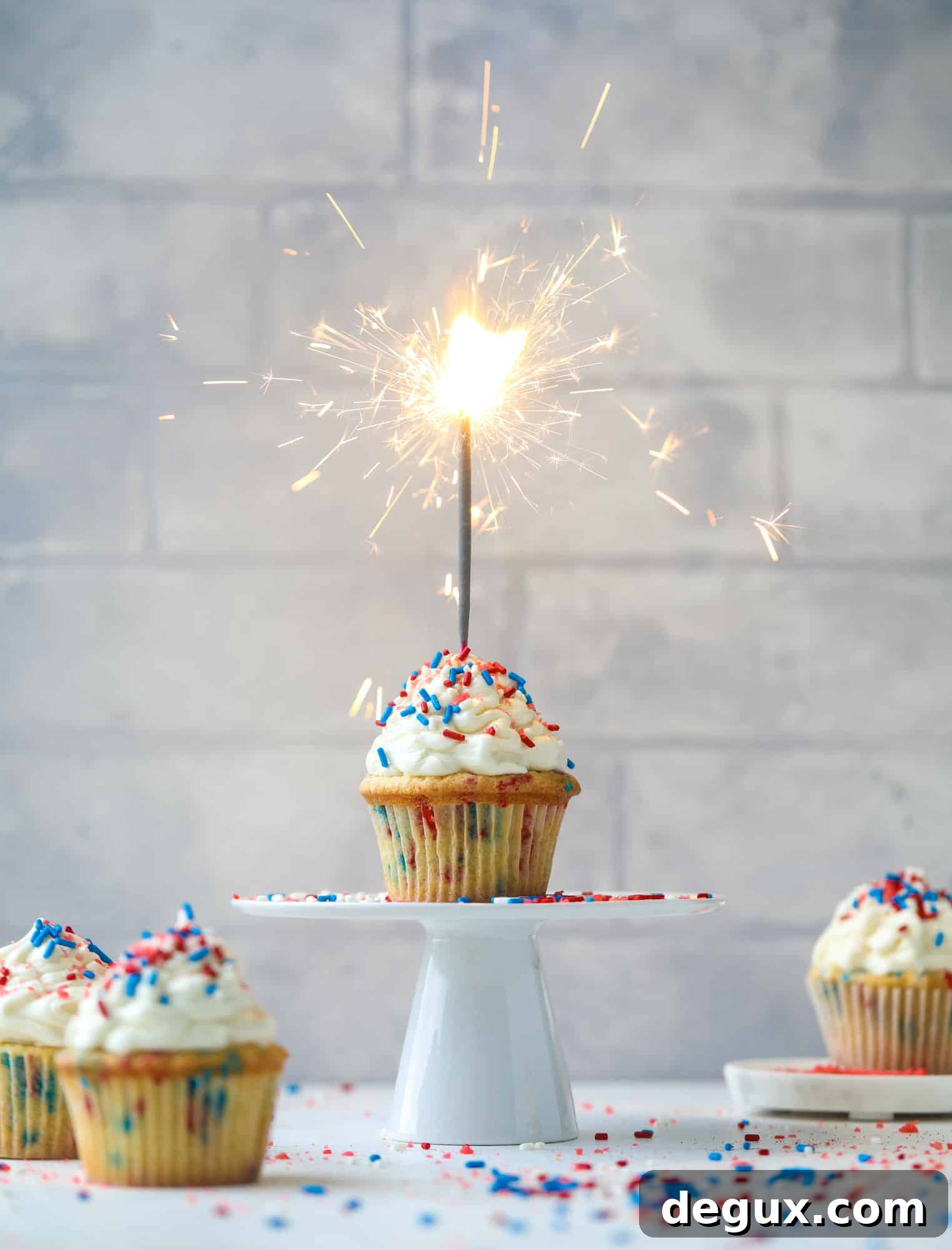 Firecracker Confetti Cupcakes Recipe for Party-Ready Treats 8 These 4th of July confetti cupcakes are super fun! Firecracker cupcakes with red, white and blue sprinkles and pop rocks candy on top for crackle!
