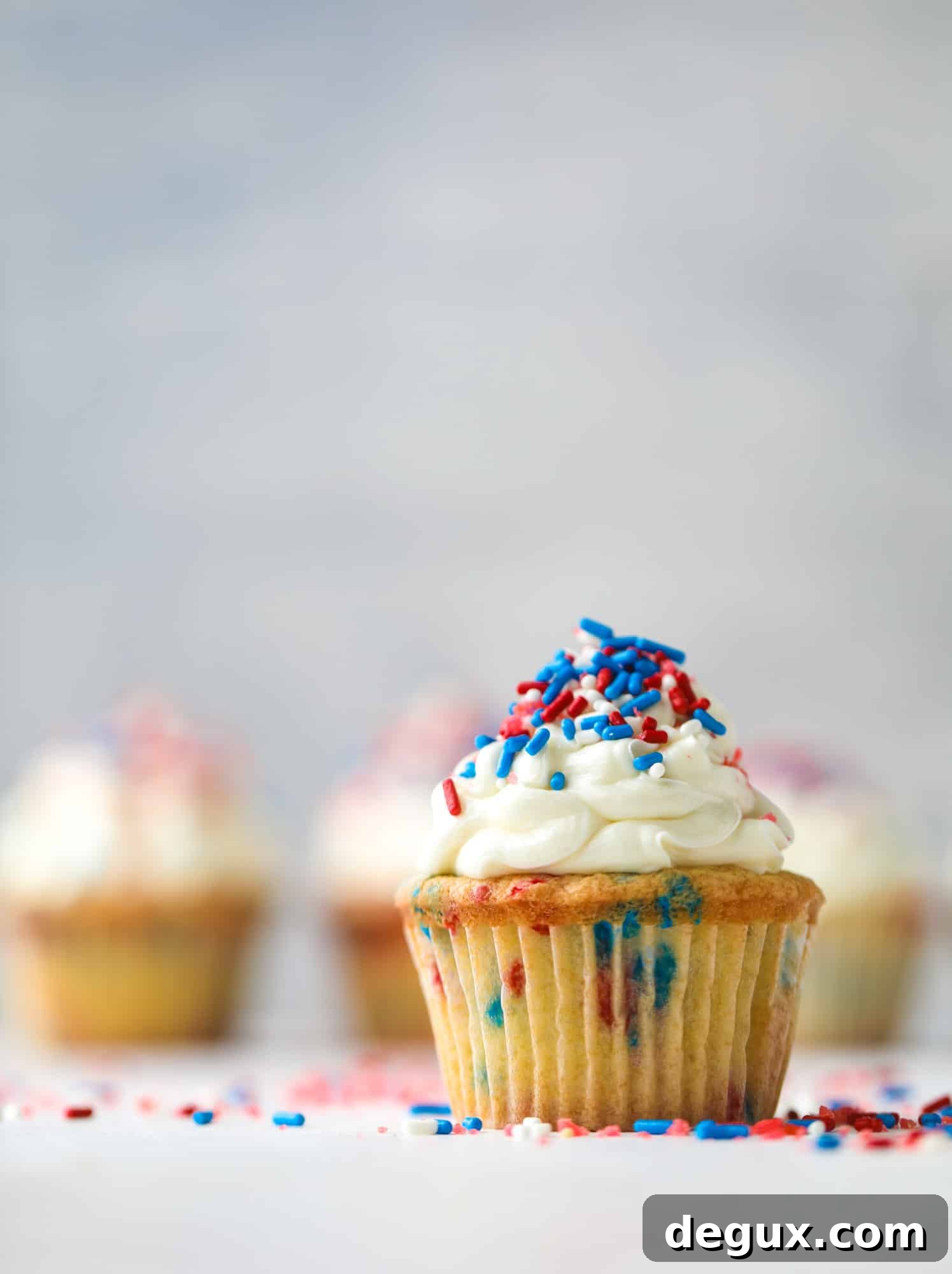 Firecracker Confetti Cupcakes Recipe for Party-Ready Treats 9 These 4th of July confetti cupcakes are super fun! Firecracker cupcakes with red, white and blue sprinkles and pop rocks candy on top for crackle!