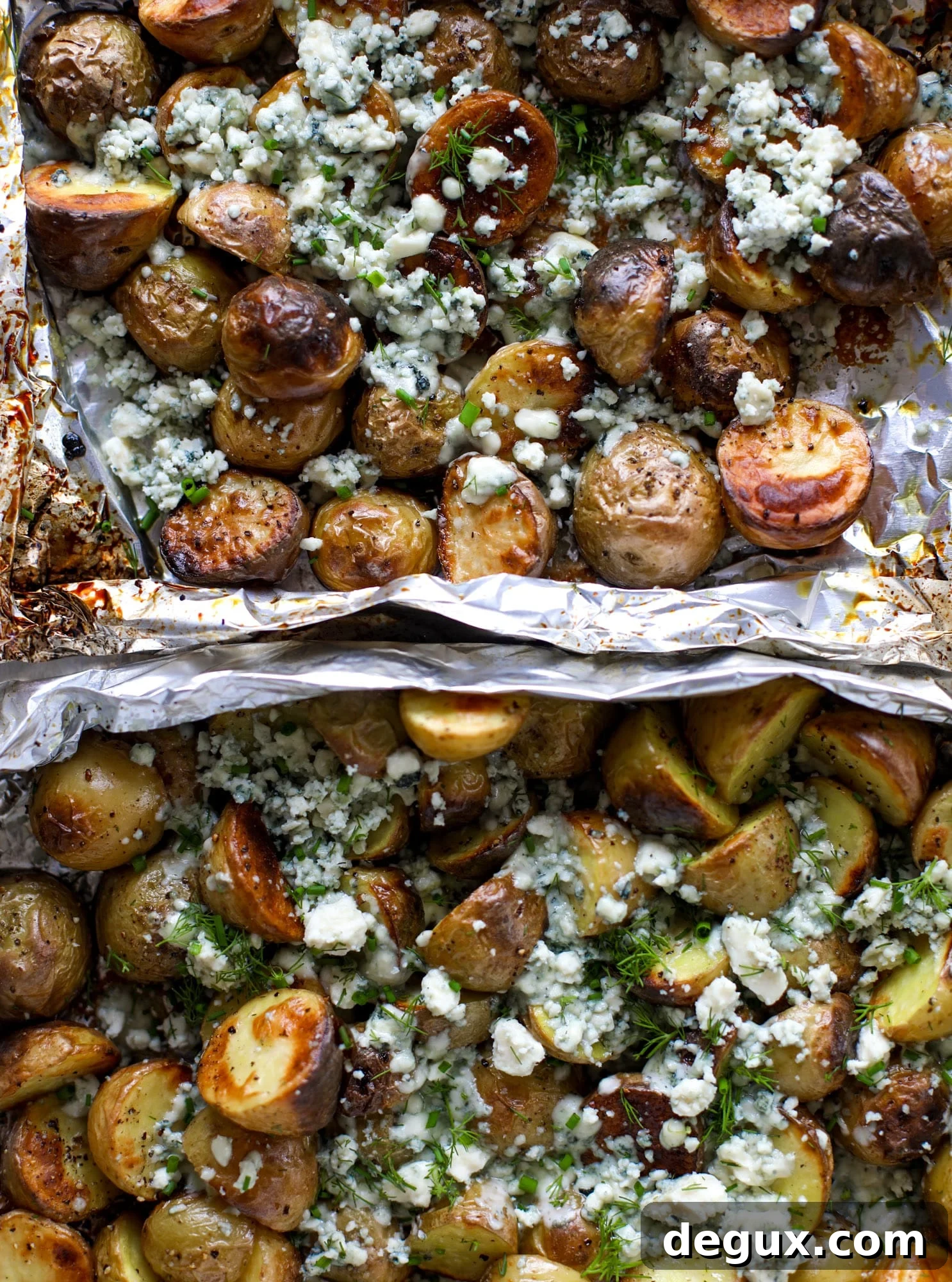 These grilled gorgonzola potatoes are loaded with flavor! Crispy, crunchy grilled baby golds topped with creamy blue cheese and fresh herbs.