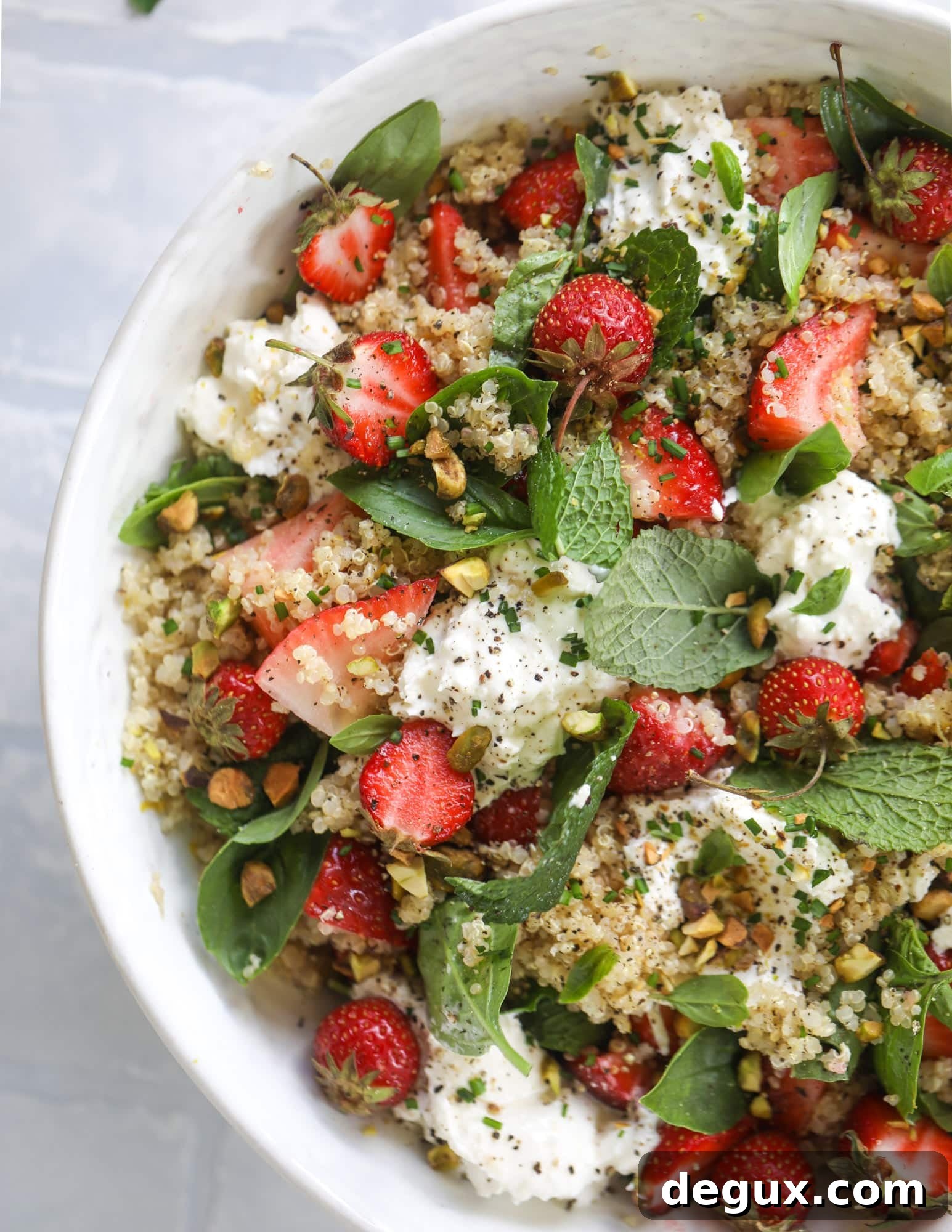 This strawberry quinoa salad is loaded with fresh herbs, burrata cheese and chopped pistachios. Topped with a lemon dressing, it's heavenly!