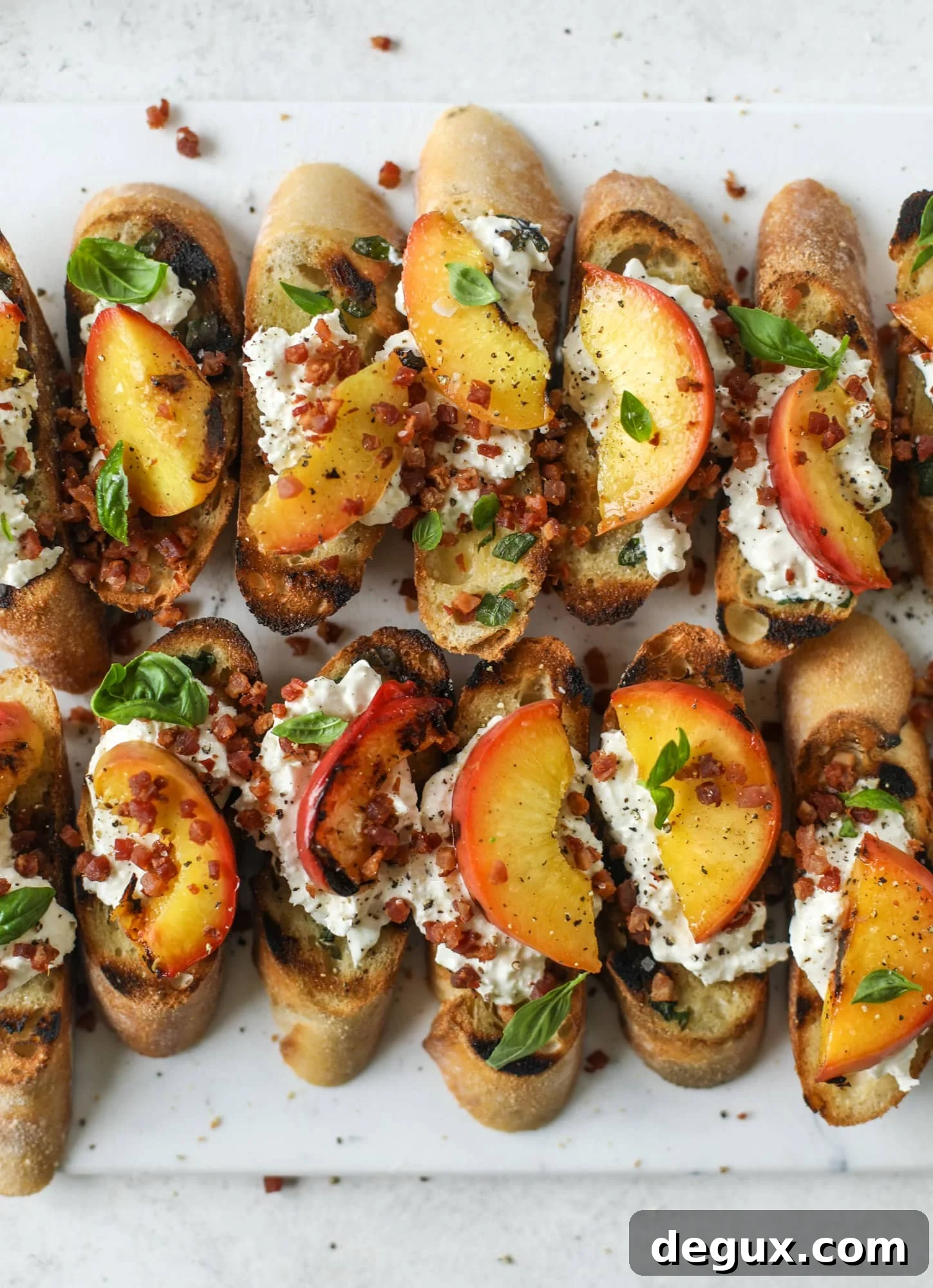 Burrata, Peach & Pancetta Crostini with Basil Butter 2 This peach burrata crostini is the best summer appetizer! it starts with grilled basil butter toasts that are topped with burrata, peach and pancetta!