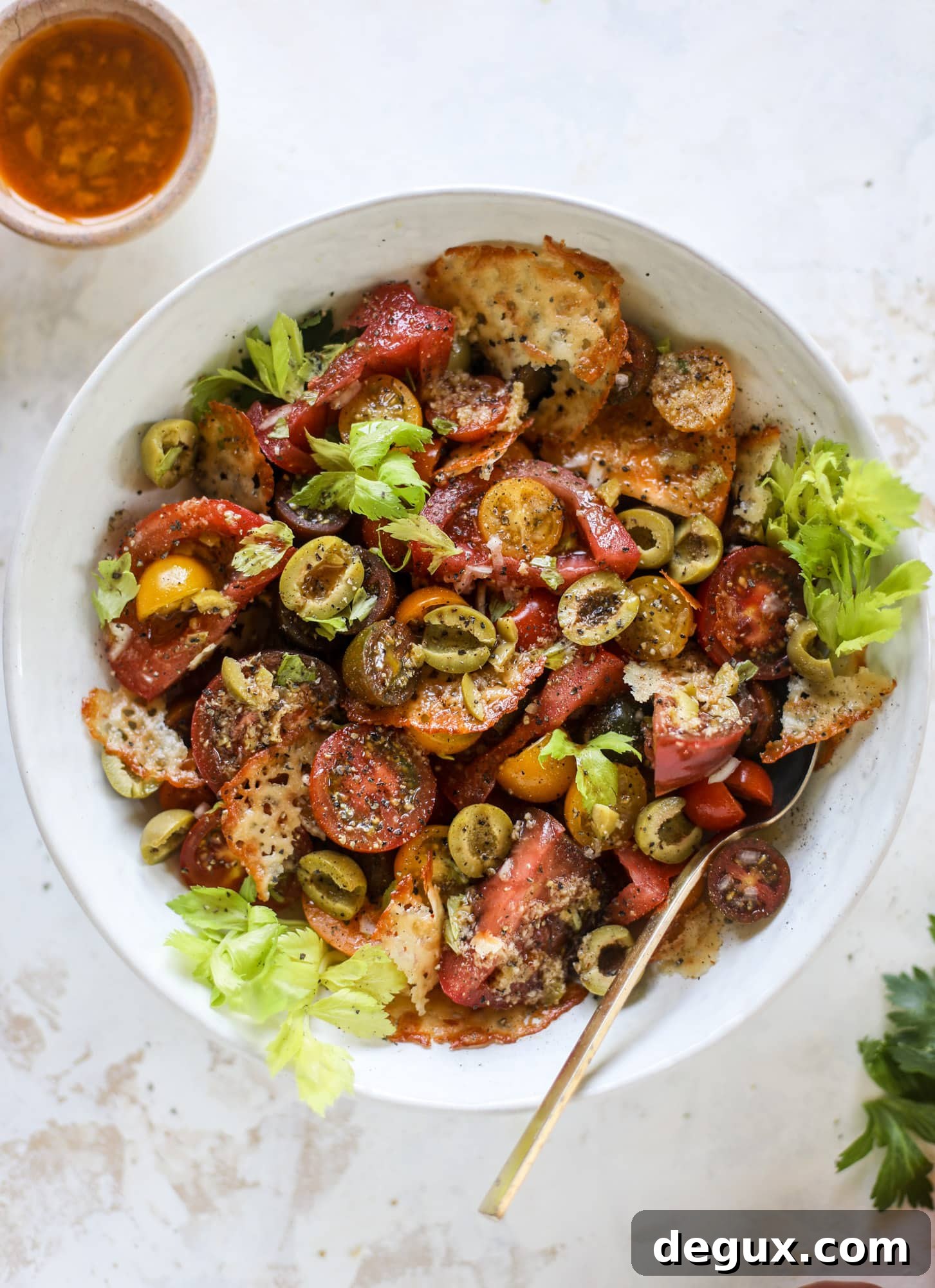 This bloody mary tomato salad has all the incredible flavor of the bloody mary cocktail! Topped with cheddar crisps, it's delicious! 