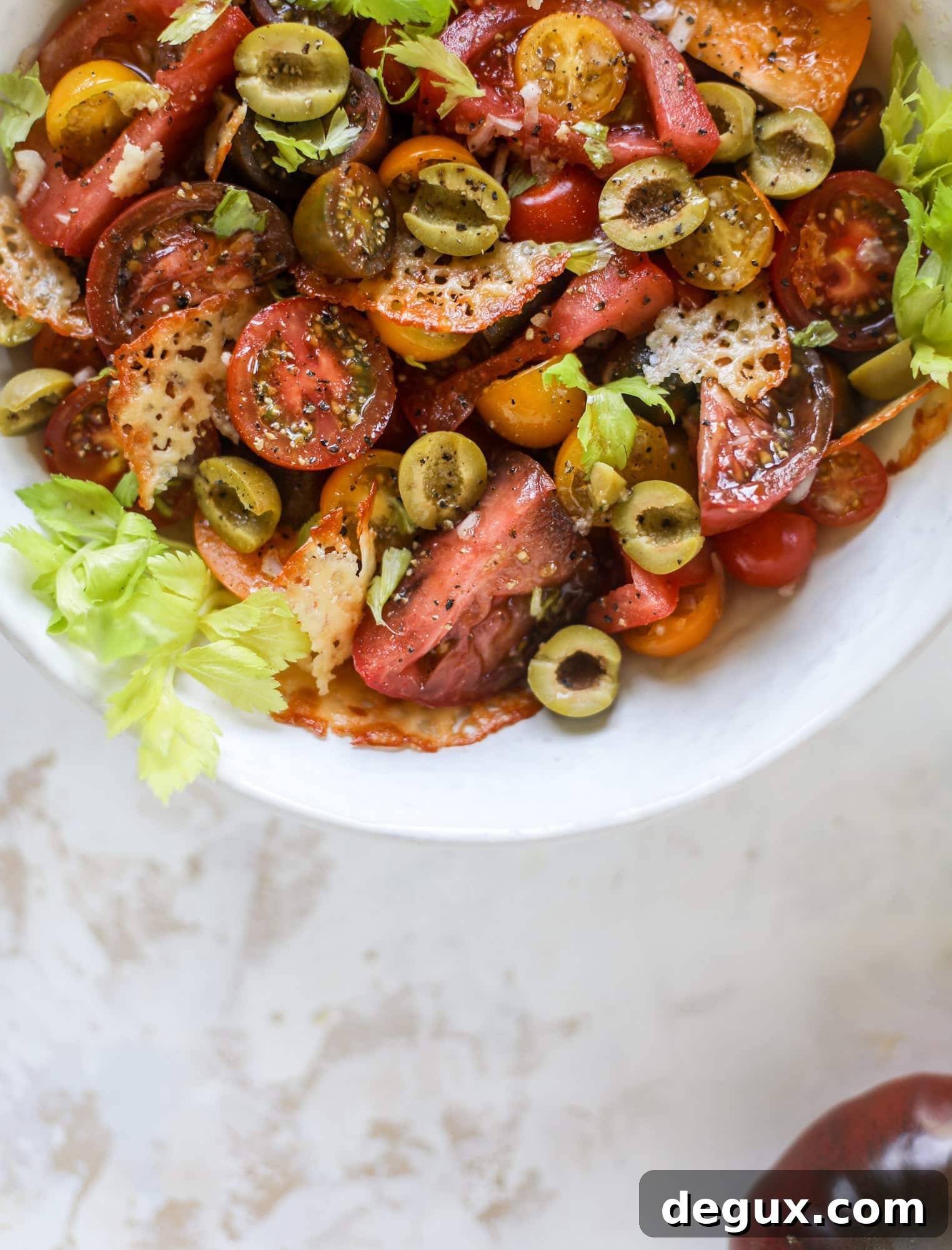 This bloody mary tomato salad has all the incredible flavor of the bloody mary cocktail! Topped with cheddar crisps, it's delicious! 