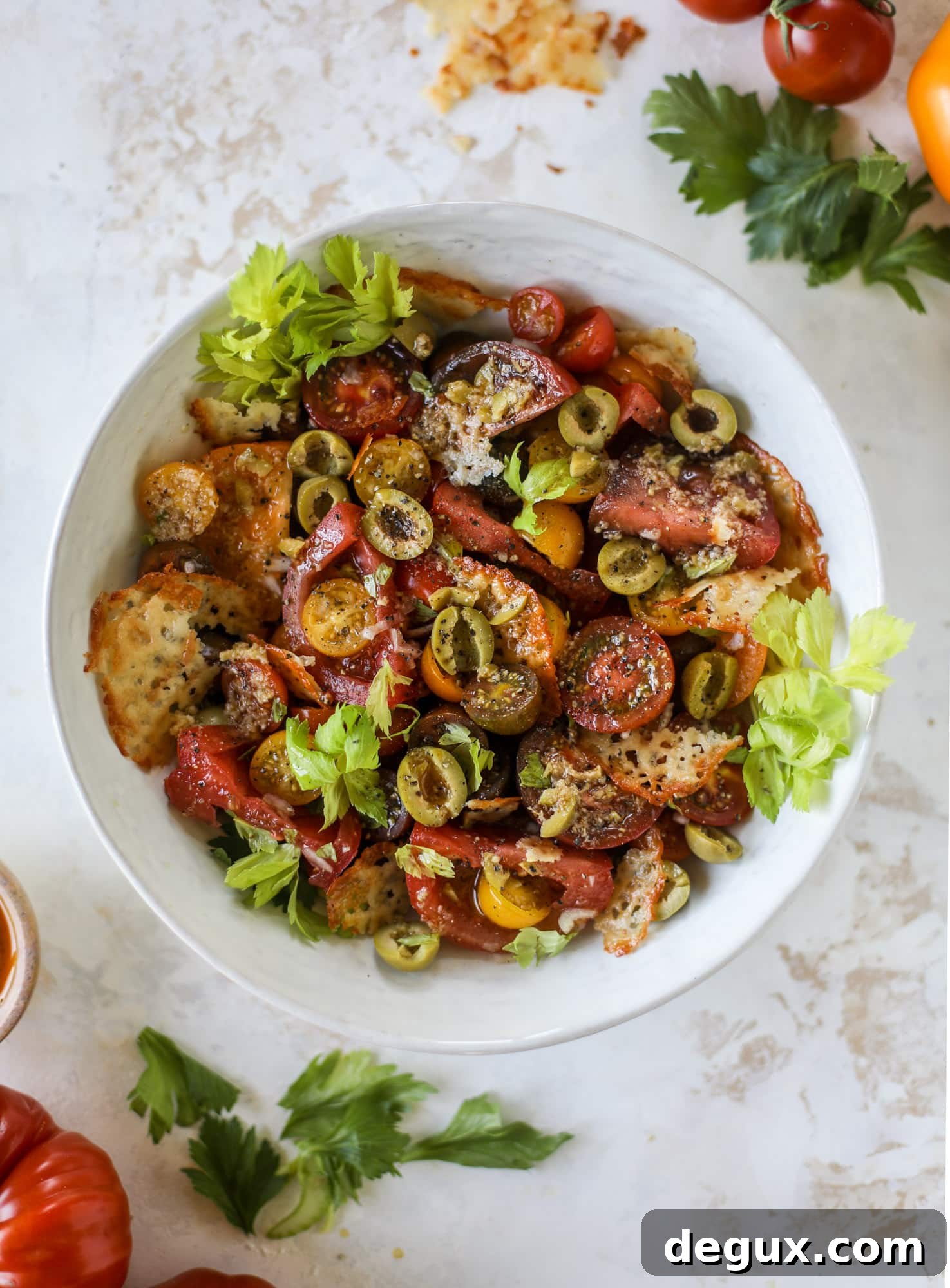 This bloody mary tomato salad has all the incredible flavor of the bloody mary cocktail! Topped with cheddar crisps, it's delicious! 