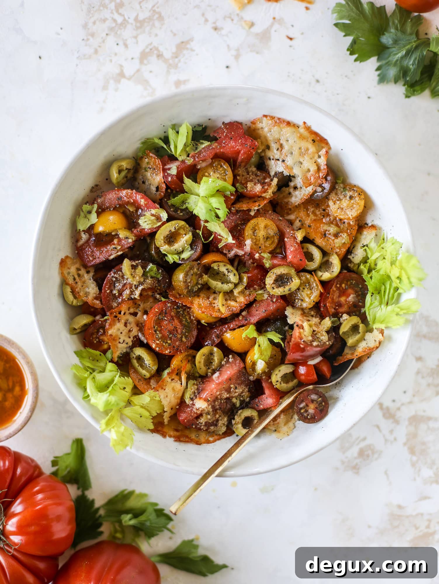 This bloody mary tomato salad has all the incredible flavor of the bloody mary cocktail! Topped with cheddar crisps, it's delicious! 