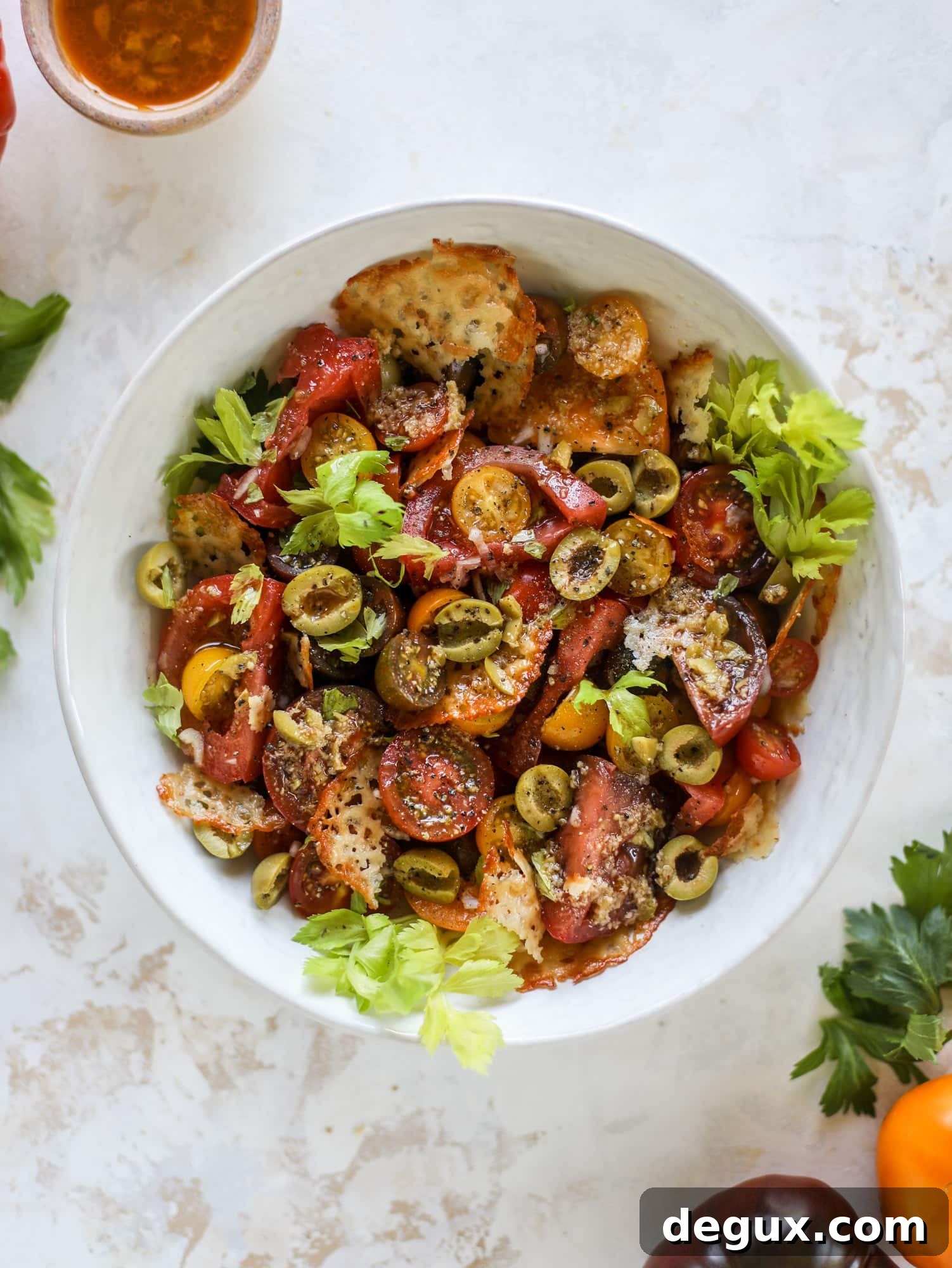 This bloody mary tomato salad has all the incredible flavor of the bloody mary cocktail! Topped with cheddar crisps, it's delicious! 