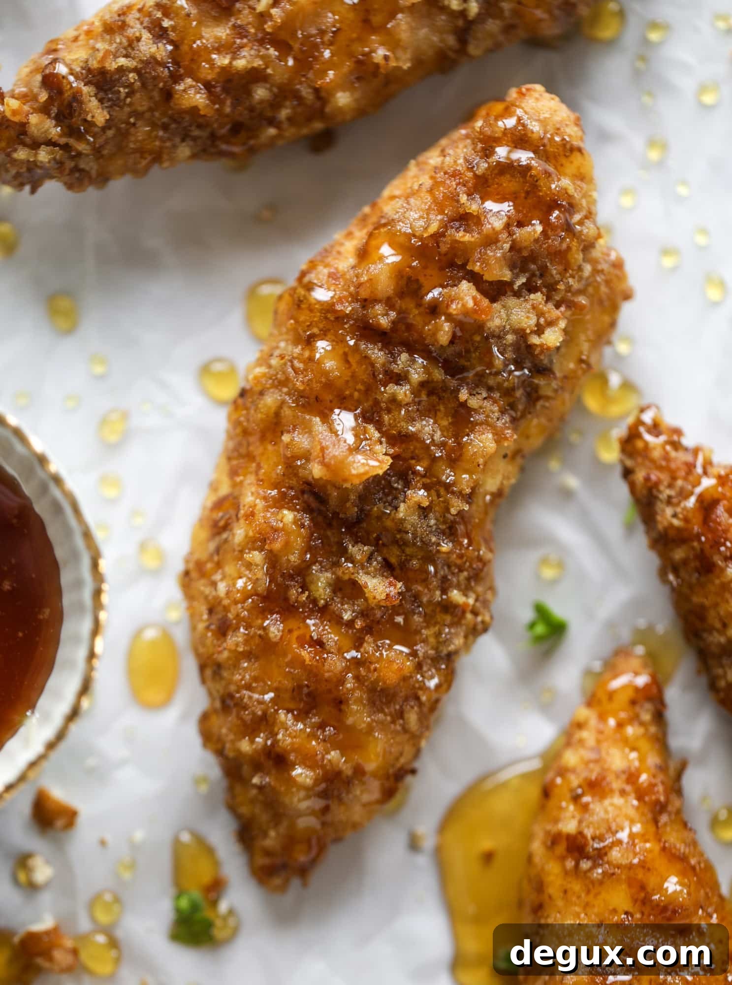 Hot Honey Pretzel Chicken Fingers with Tangy House Sauce 5 These pretzel crusted chicken fingers are baked, crunchy and ridiculously flavorful. Drizzle with hot honey and dip in house sauce. Yum!