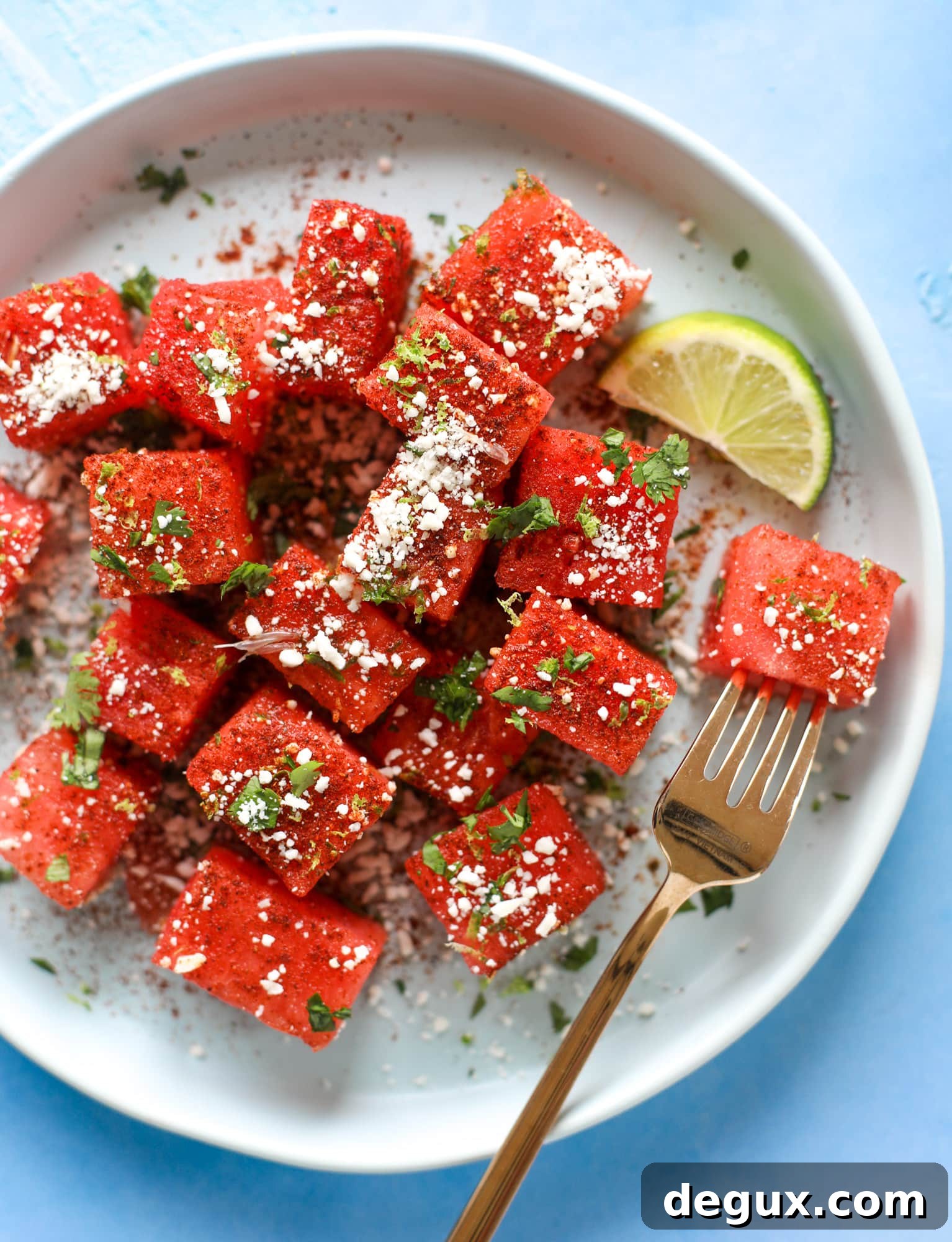 This chili lime watermelon is the perfect summer snack! It's savory and sweet with crumbled cotija cheese and lots of lime. Delish!