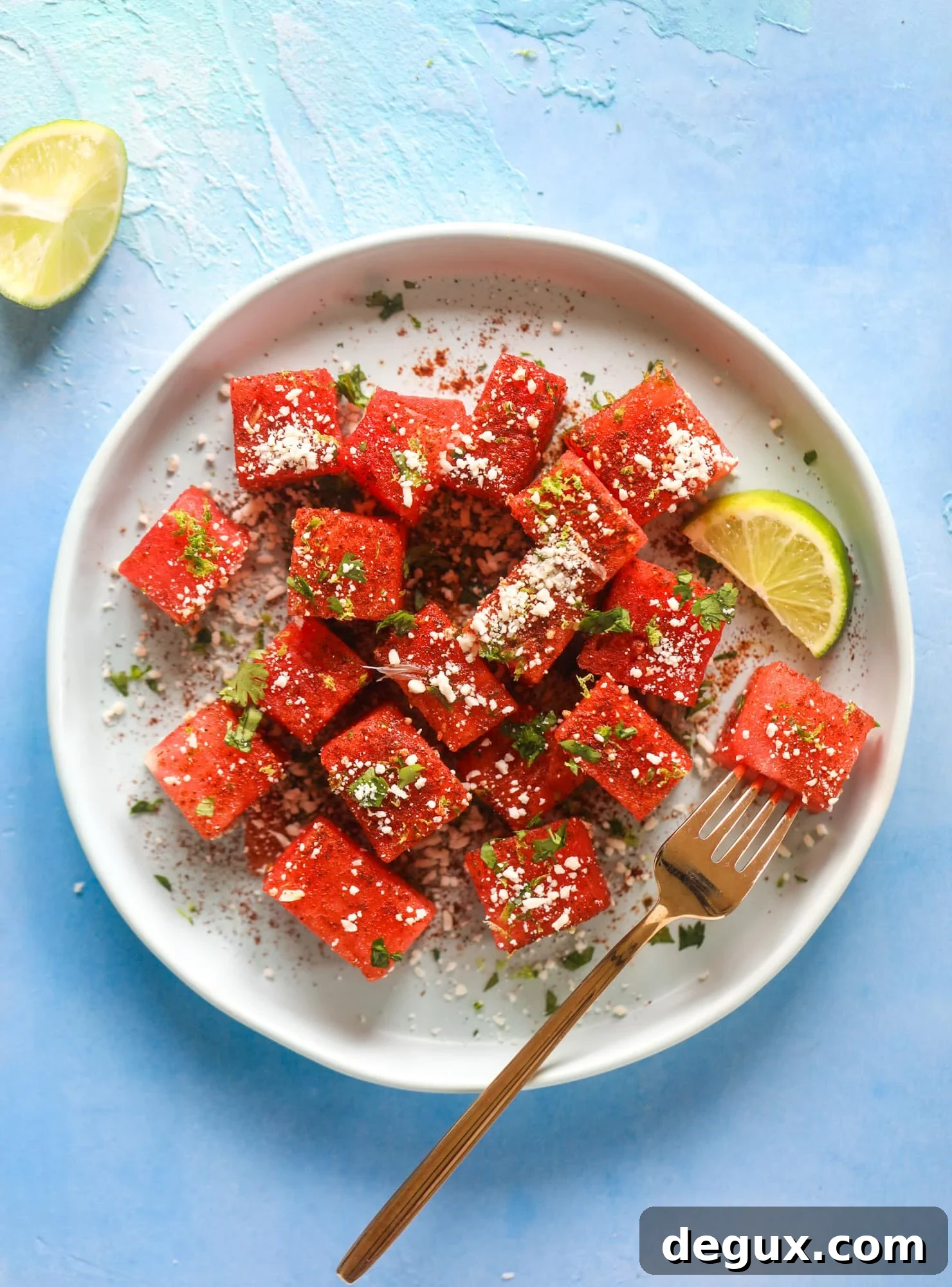 This chili lime watermelon is the perfect summer snack! It's savory and sweet with crumbled cotija cheese and lots of lime. Delish!