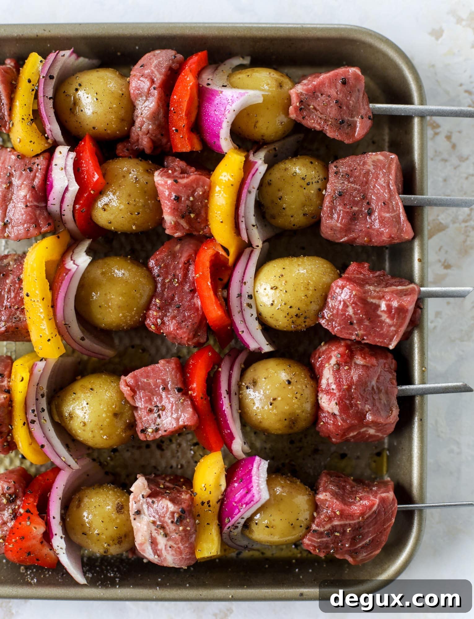 Grilled Filet and Potato Skewers with Rosemary Chimichurri Sauce 3 kebabs ready for the grill