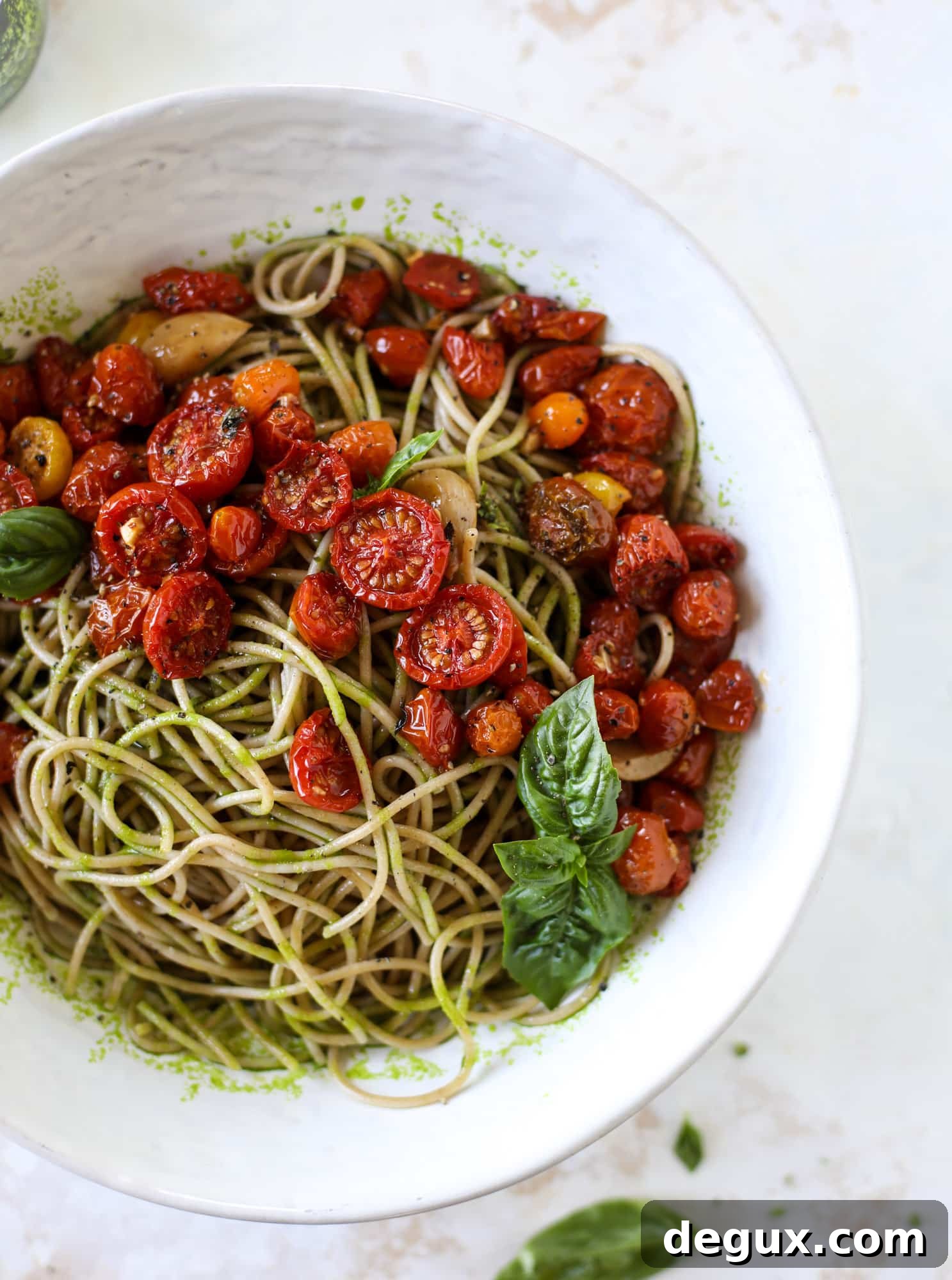This tomato basil pasta is a labor of love! Made with slow roasted tomatoes, basil oil and tons of parmesan, it's ridiculously full of flavor.