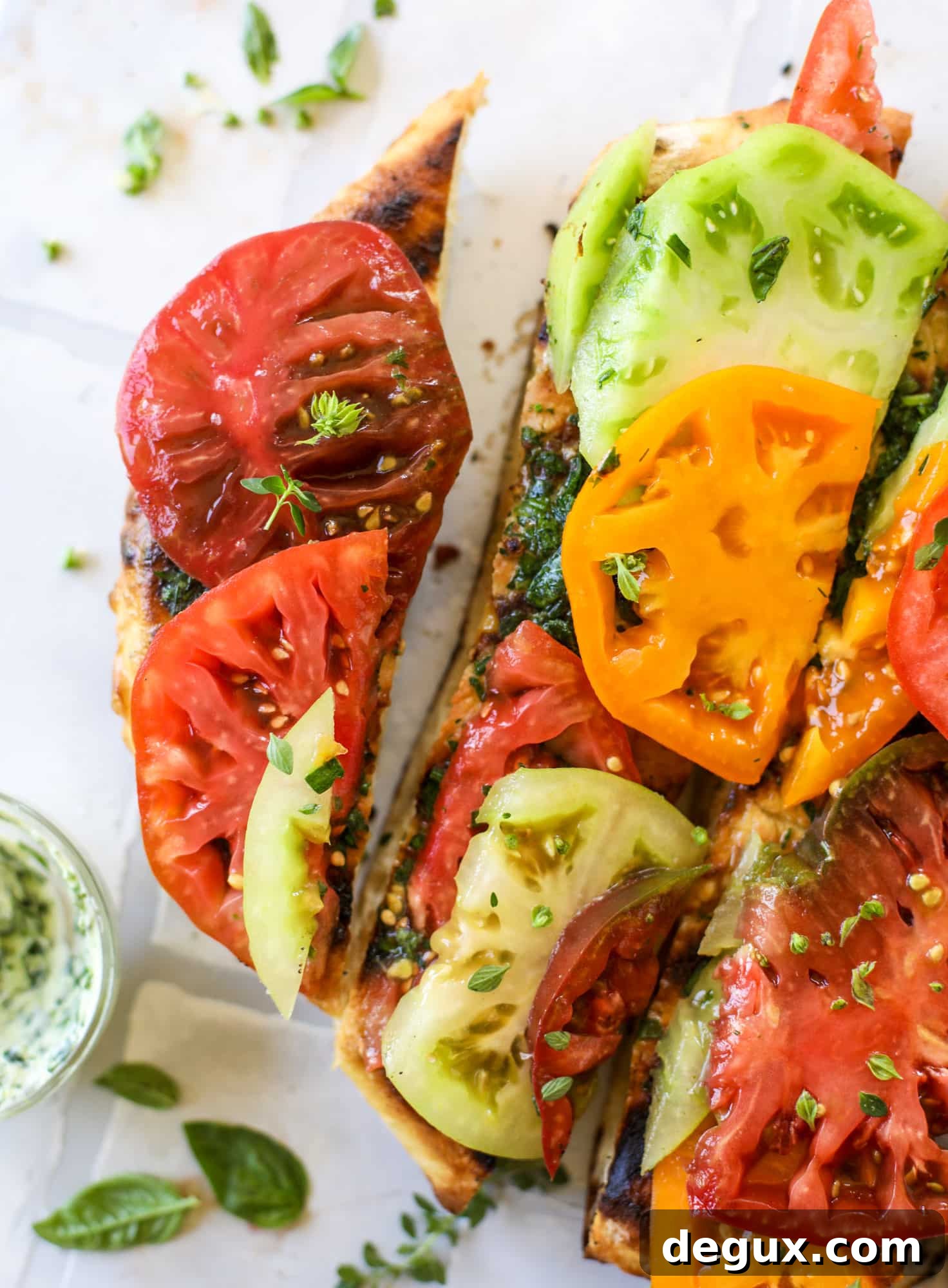 Grilled Garlic-Herb Butter Pizza with Heirloom Tomatoes 10 This heirloom tomato pizza starts with a grilled garlic herb butter crust! Melty herb butter and sliced fresh tomatoes top it off for a delicious bite!
