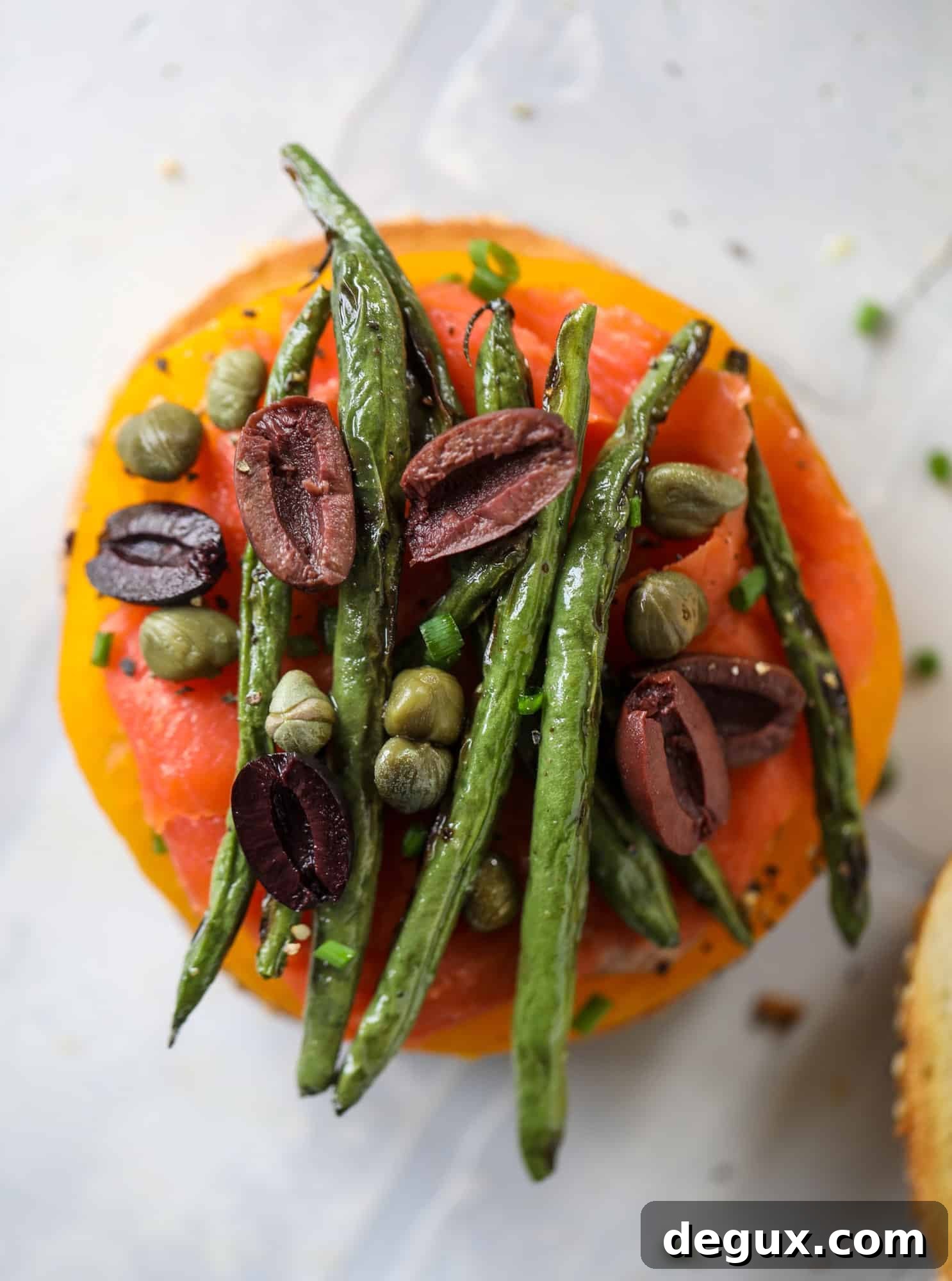 These nicoise bagels are a spin on my favorite salad! Loaded with smoked salmon, blistered green beans and tons of goodness. They are delish!